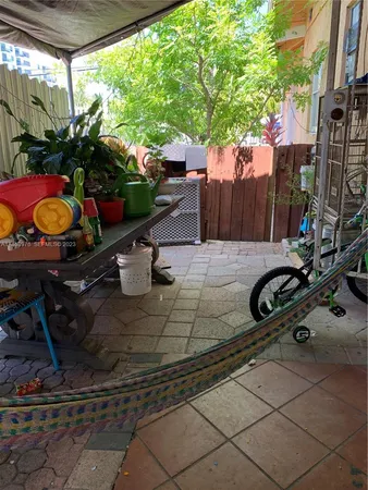 a view of a backyard with sitting area and furniture