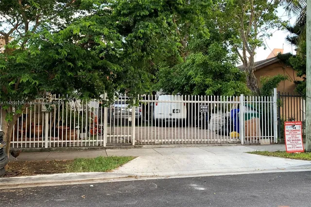 a view of a park with a street