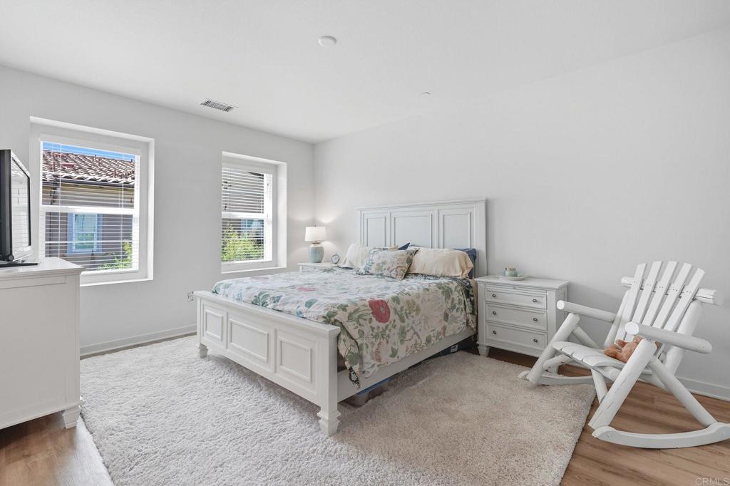 122 Diamante Road San Marcos, CA 92078 - Photo 12 of 36 a bedroom with a bed chair and window