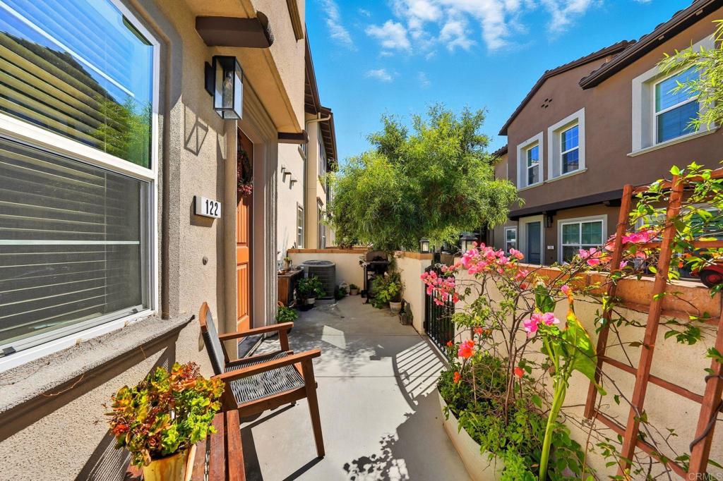 122 Diamante Road San Marcos, CA 92078 - Photo 36 of 36 a front view of a multi story building with yard