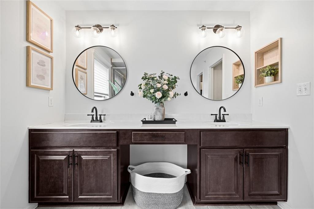139 Rylie Drive Harmony, PA 16037 - Photo 30 of 46 a bathroom with a granite countertop toilet a sink and a mirror