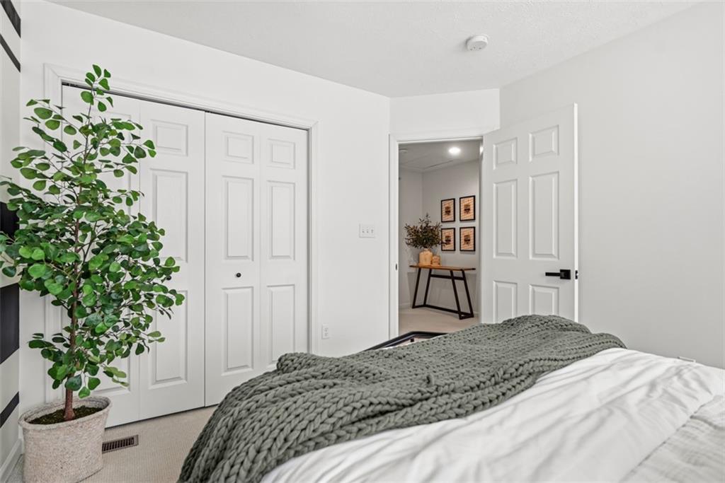 139 Rylie Drive Harmony, PA 16037 - Photo 36 of 46 a bedroom with a bed and a plant