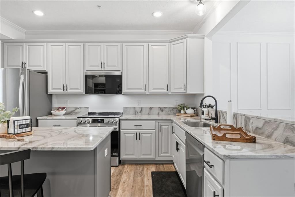 139 Rylie Drive Harmony, PA 16037 - Photo 8 of 46 a kitchen with stainless steel appliances granite countertop a sink stove refrigerator and cabinets
