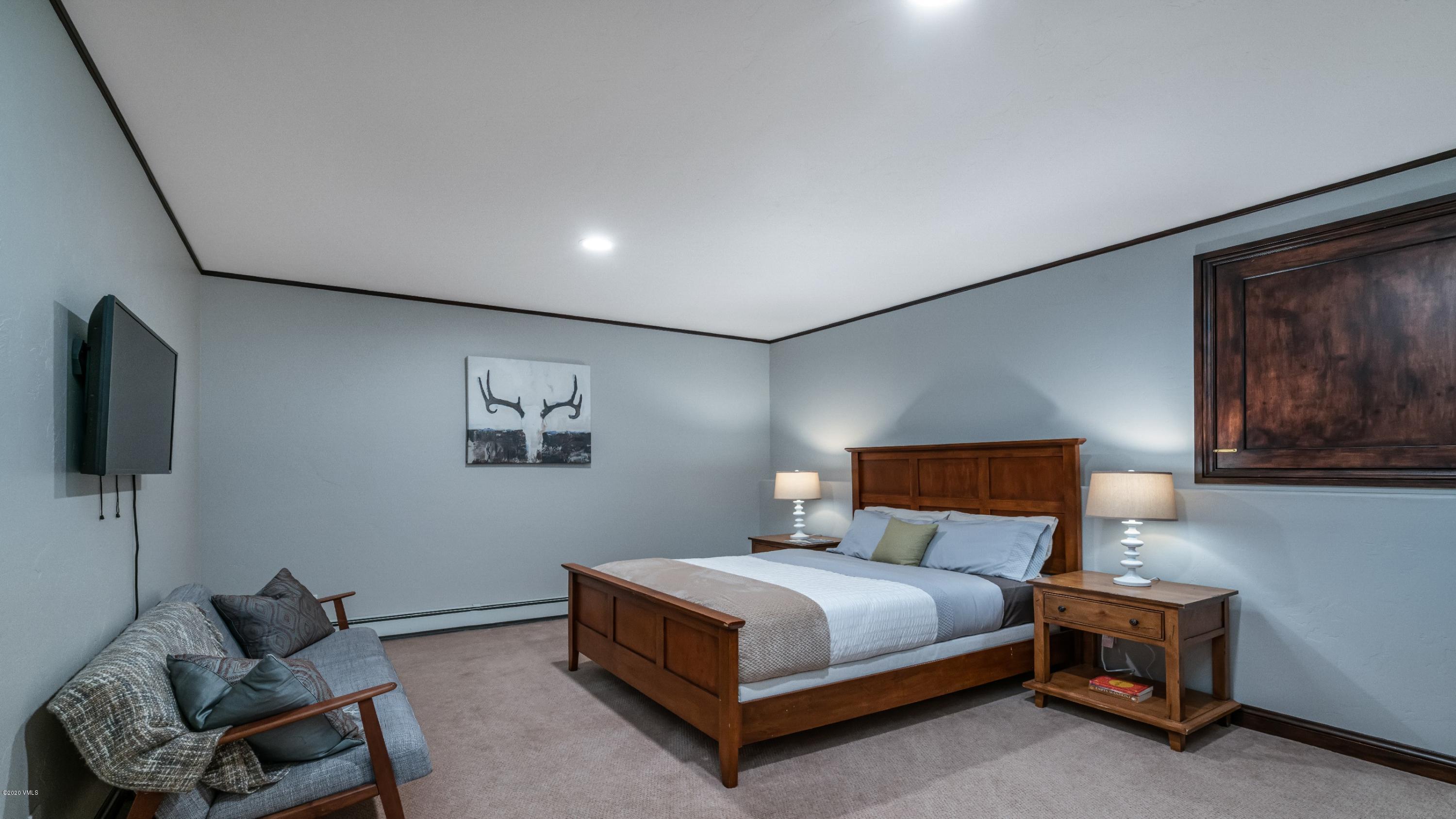 52 Andover Trail Edwards, CO 81632 - Photo 20 of 33 a bedroom with a bed and chair