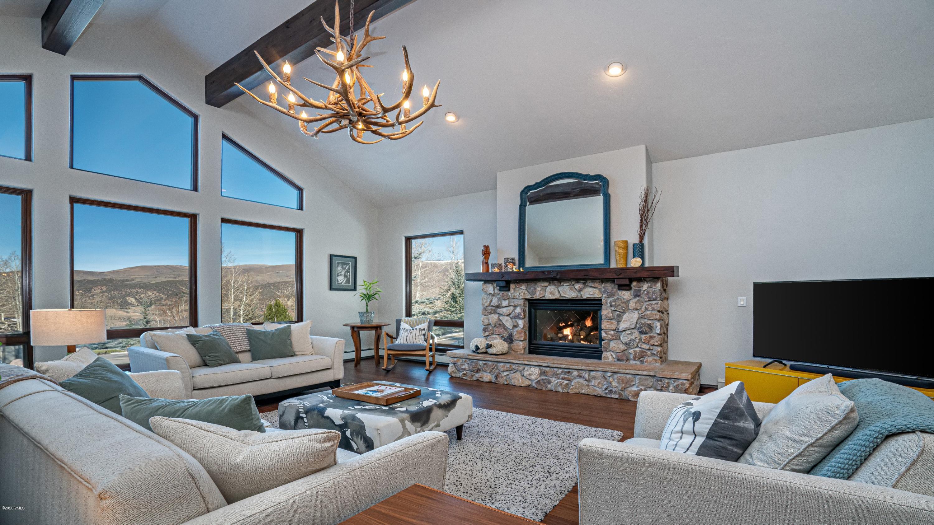 52 Andover Trail Edwards, CO 81632 - Photo 2 of 33 a living room with furniture fireplace and a large window