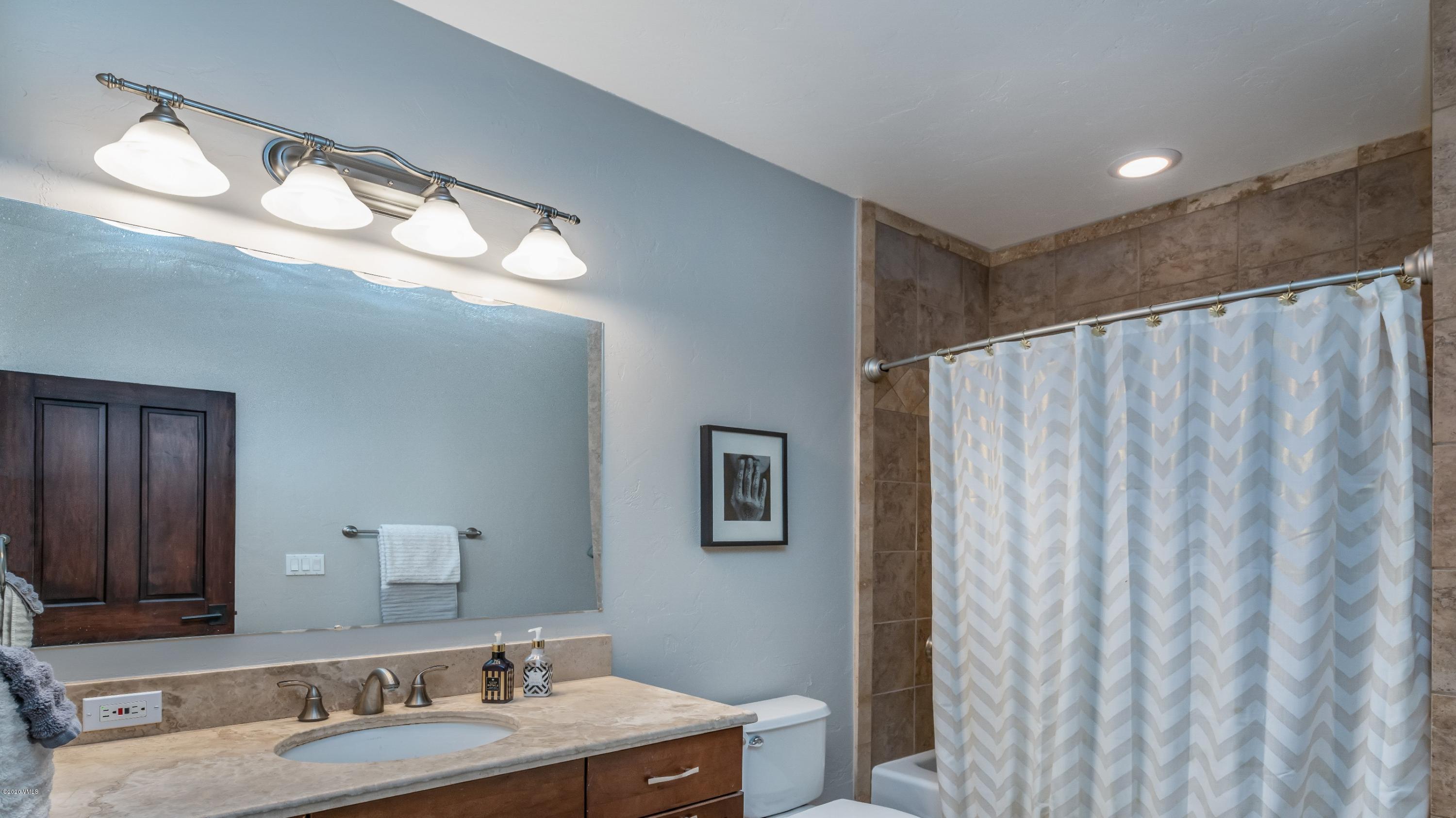 52 Andover Trail Edwards, CO 81632 - Photo 21 of 33 a bathroom with a sink and a mirror