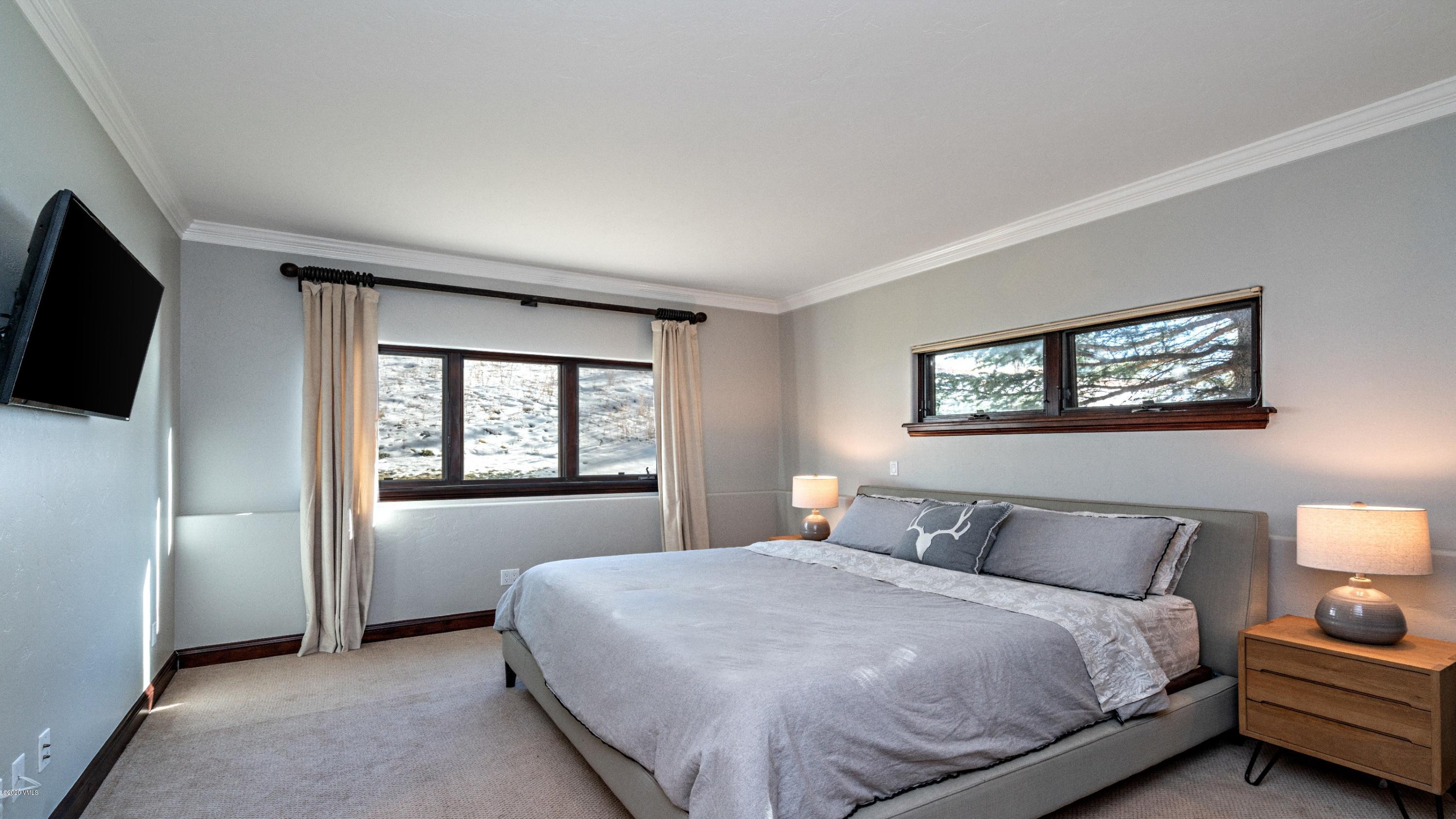 52 Andover Trail Edwards, CO 81632 - Photo 23 of 33 a bedroom with a bed and a window