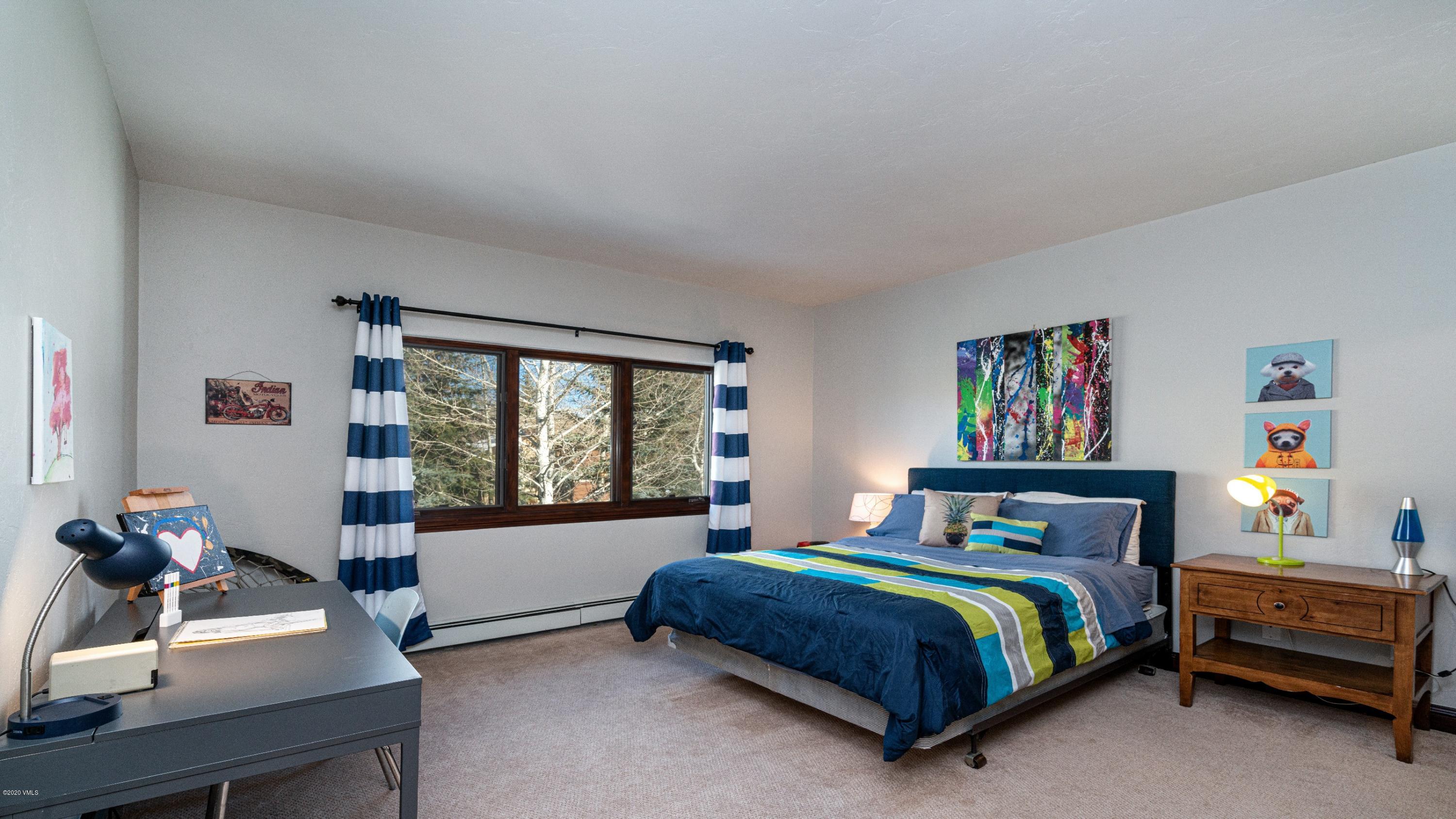 52 Andover Trail Edwards, CO 81632 - Photo 26 of 33 a bedroom with a bed and a window