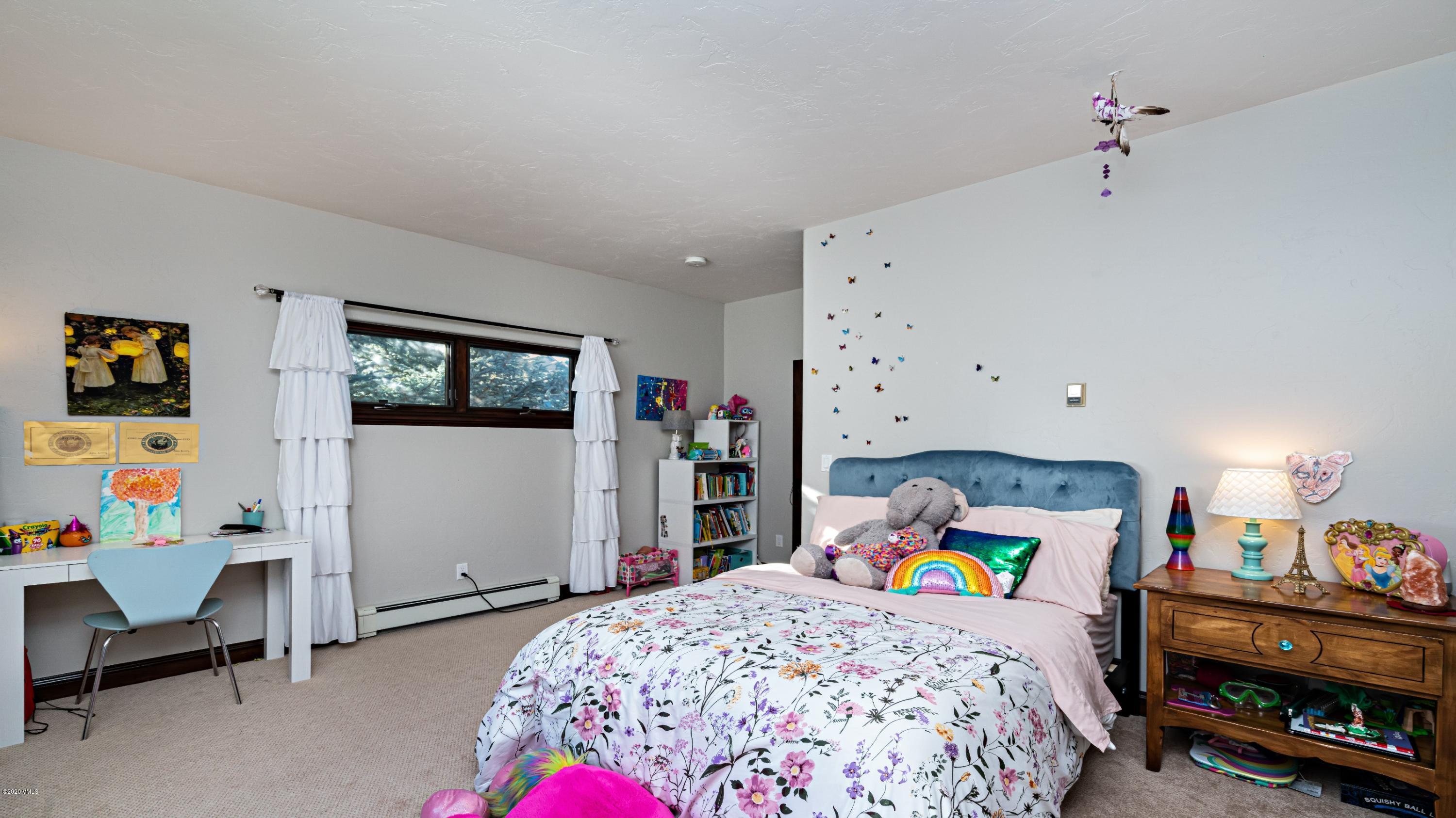 52 Andover Trail Edwards, CO 81632 - Photo 27 of 33 a bedroom that has a bed and a tv in it