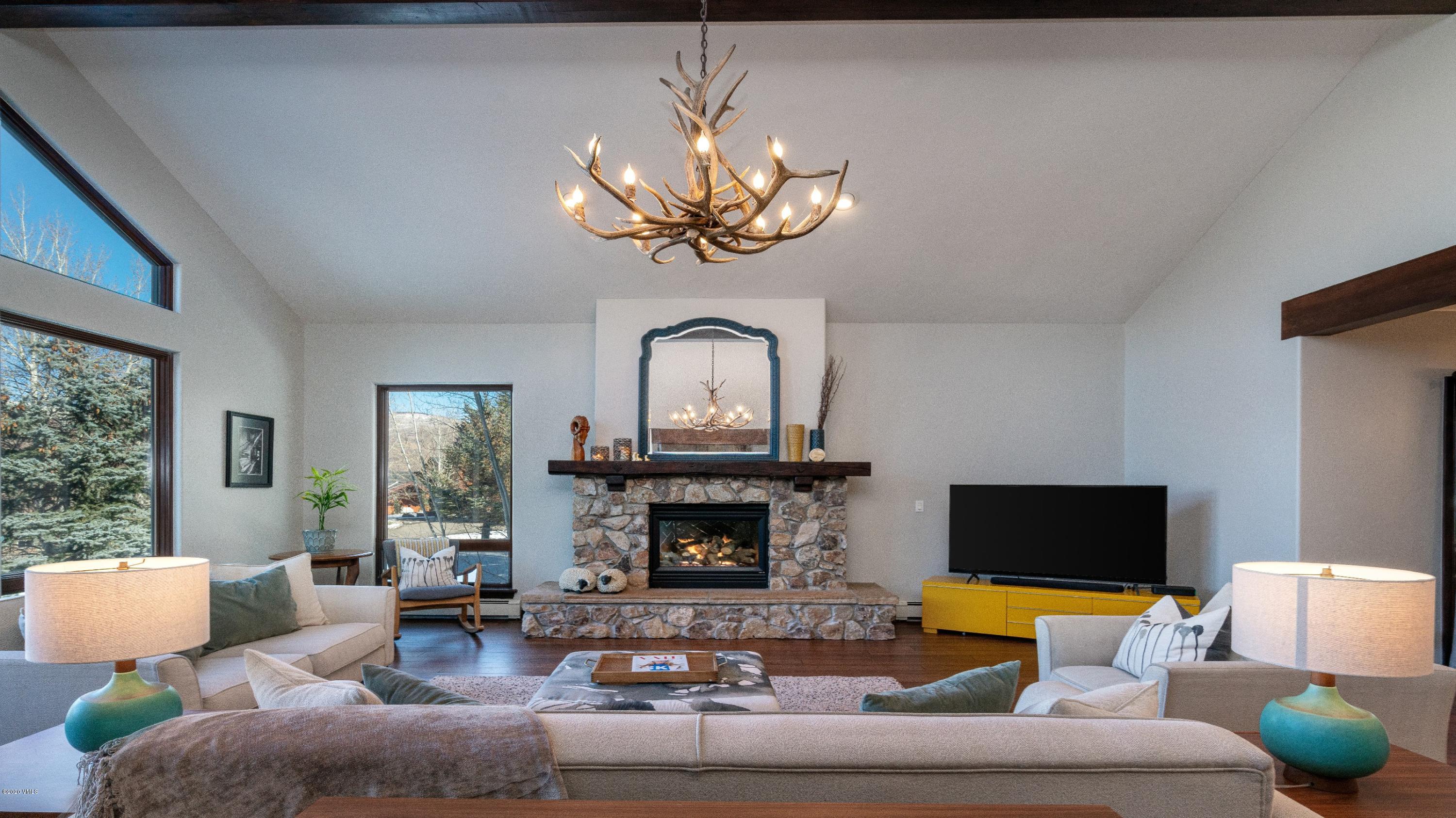 52 Andover Trail Edwards, CO 81632 - Photo 3 of 33 a living room with furniture a fireplace and a flat screen tv