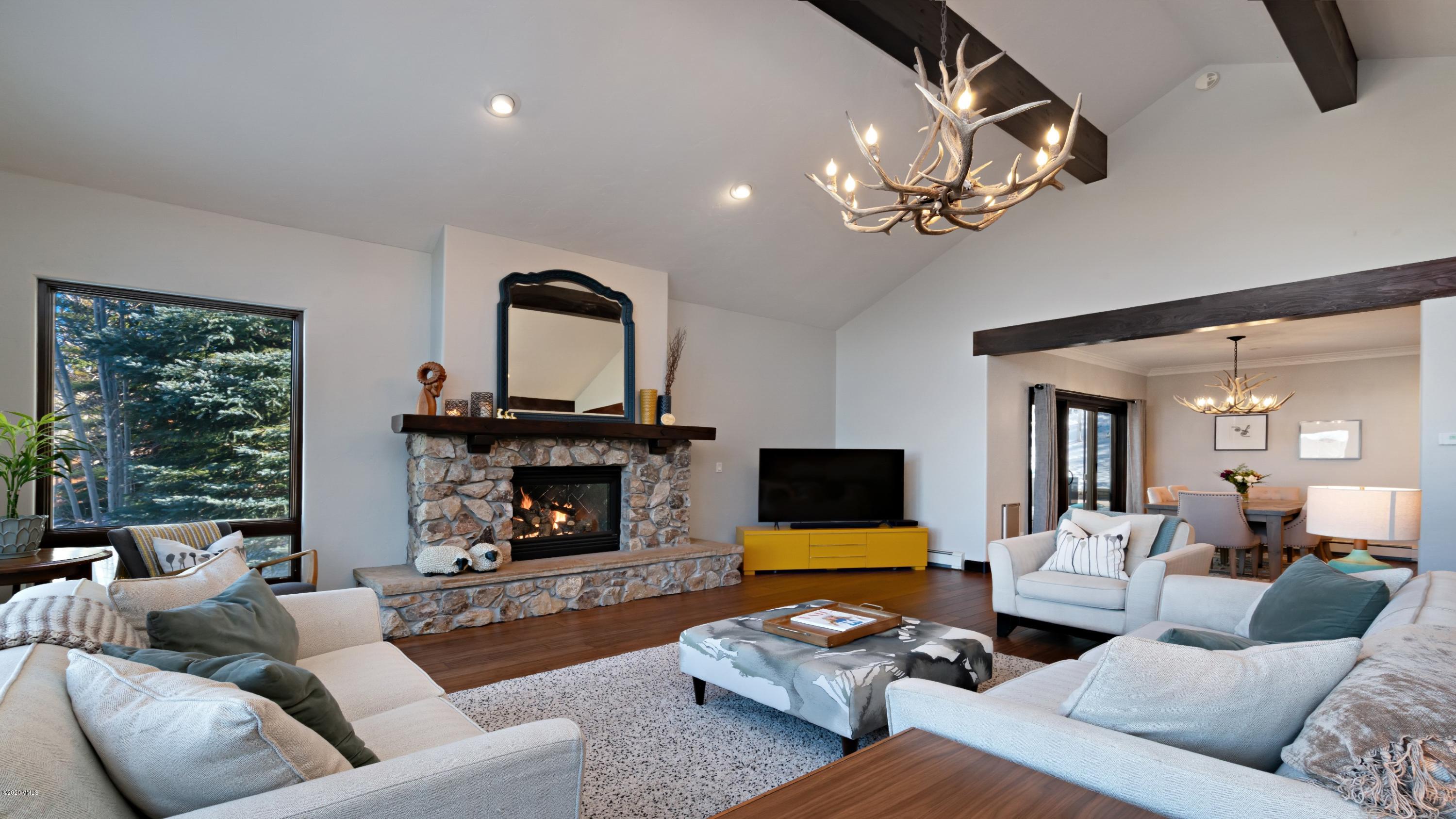 52 Andover Trail Edwards, CO 81632 - Photo 5 of 33 a living room with patio furniture and a fireplace