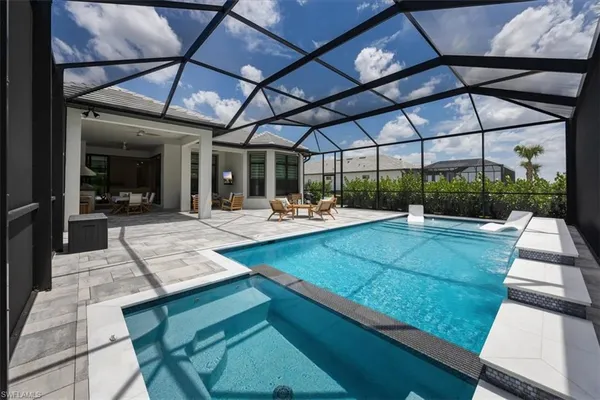 a view of a backyard with sitting area