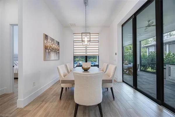 a dining room with furniture window wooden floor