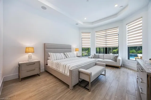 a bedroom with a bed and a couch