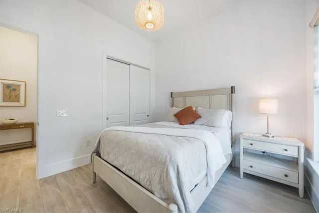 a bedroom with a bed and a table