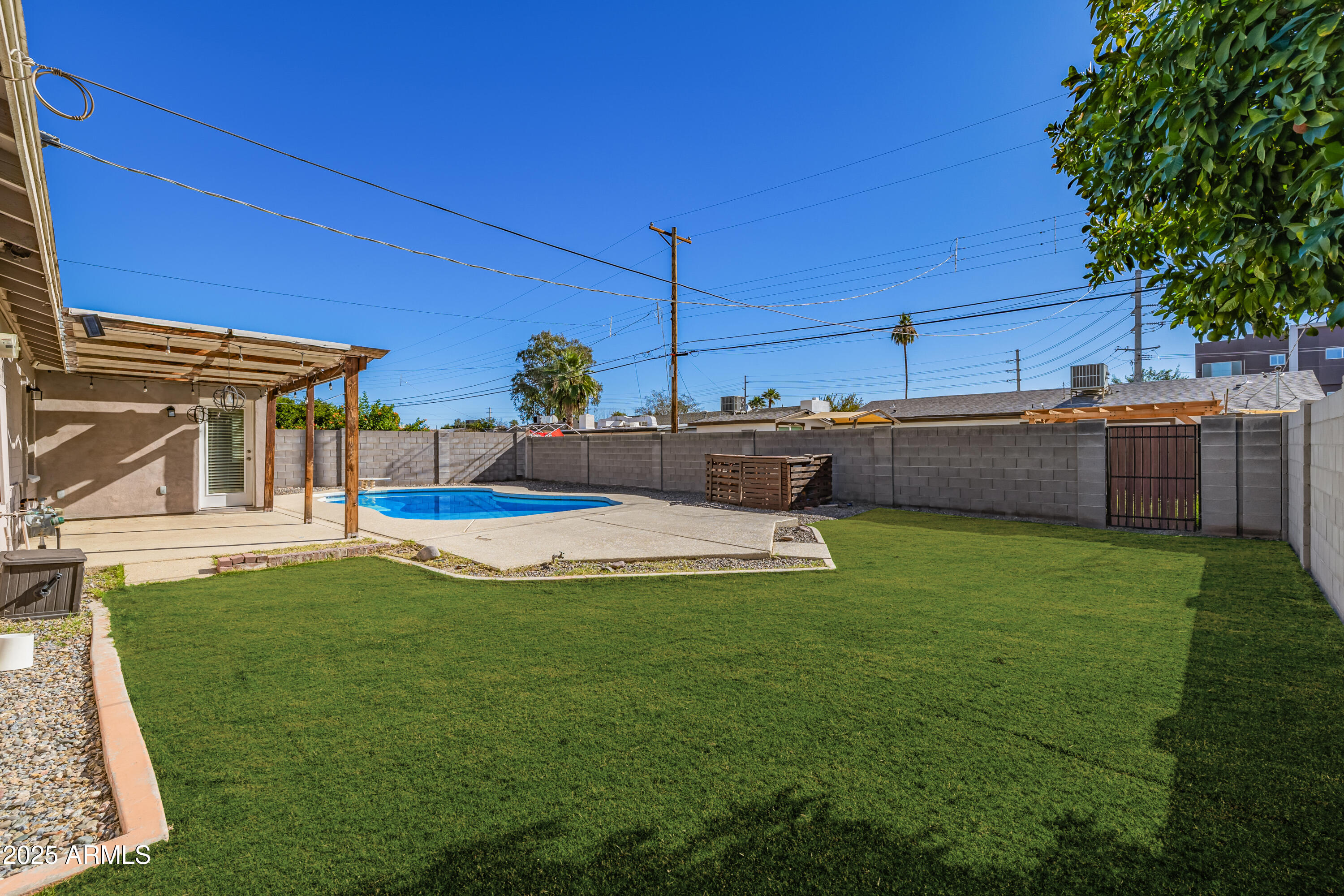 2439 East Minnezona Avenue Phoenix, AZ 85016 - Photo 22 of 25 a view of a house with a backyard porch and sitting area