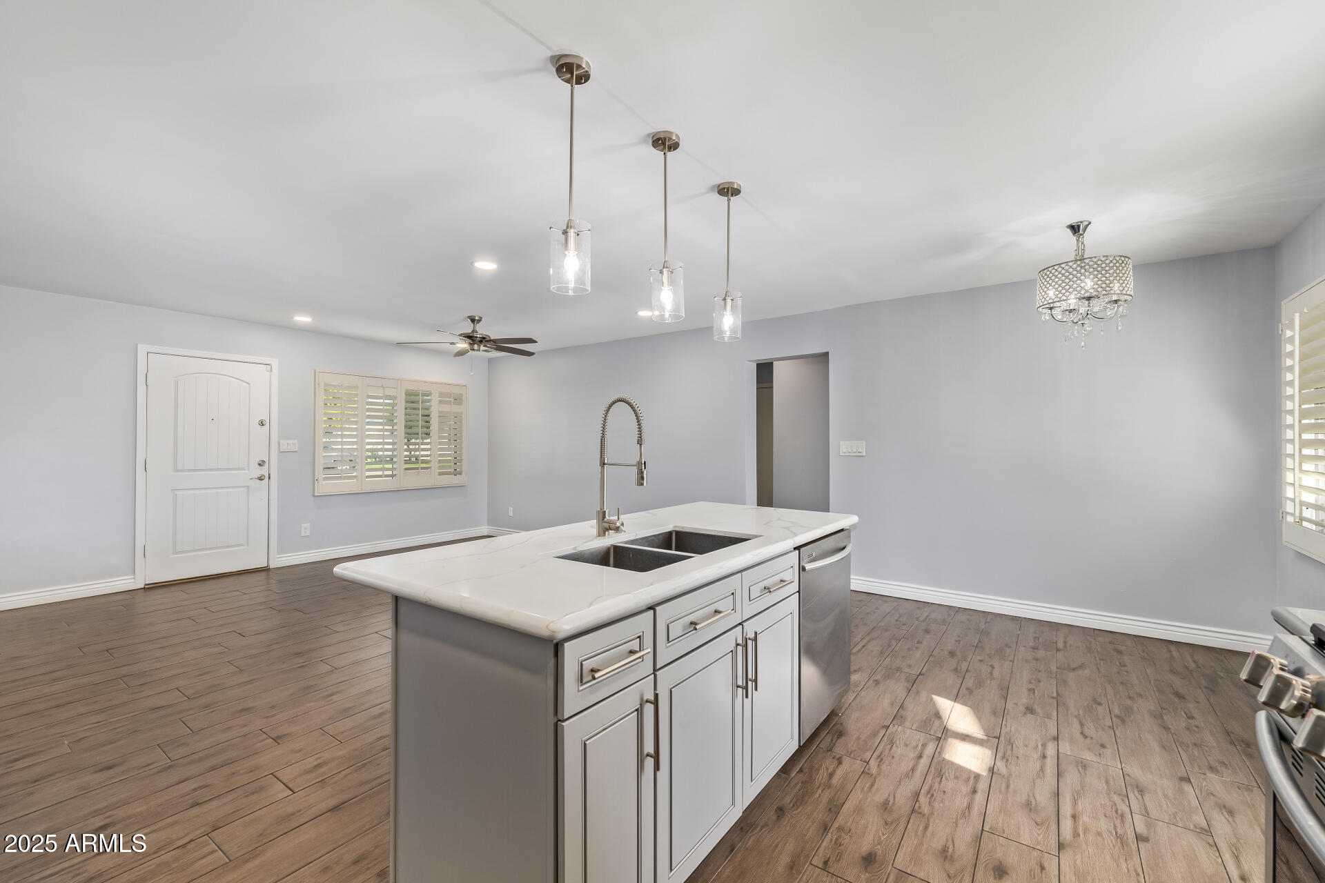 2439 East Minnezona Avenue Phoenix, AZ 85016 - Photo 5 of 25 a kitchen with a sink stove and wooden floor