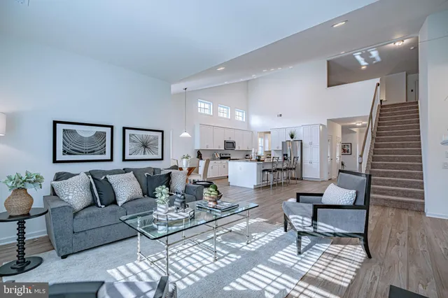 a bedroom with a large bed and a large window