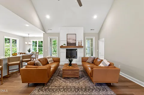 a living room with furniture fireplace and window