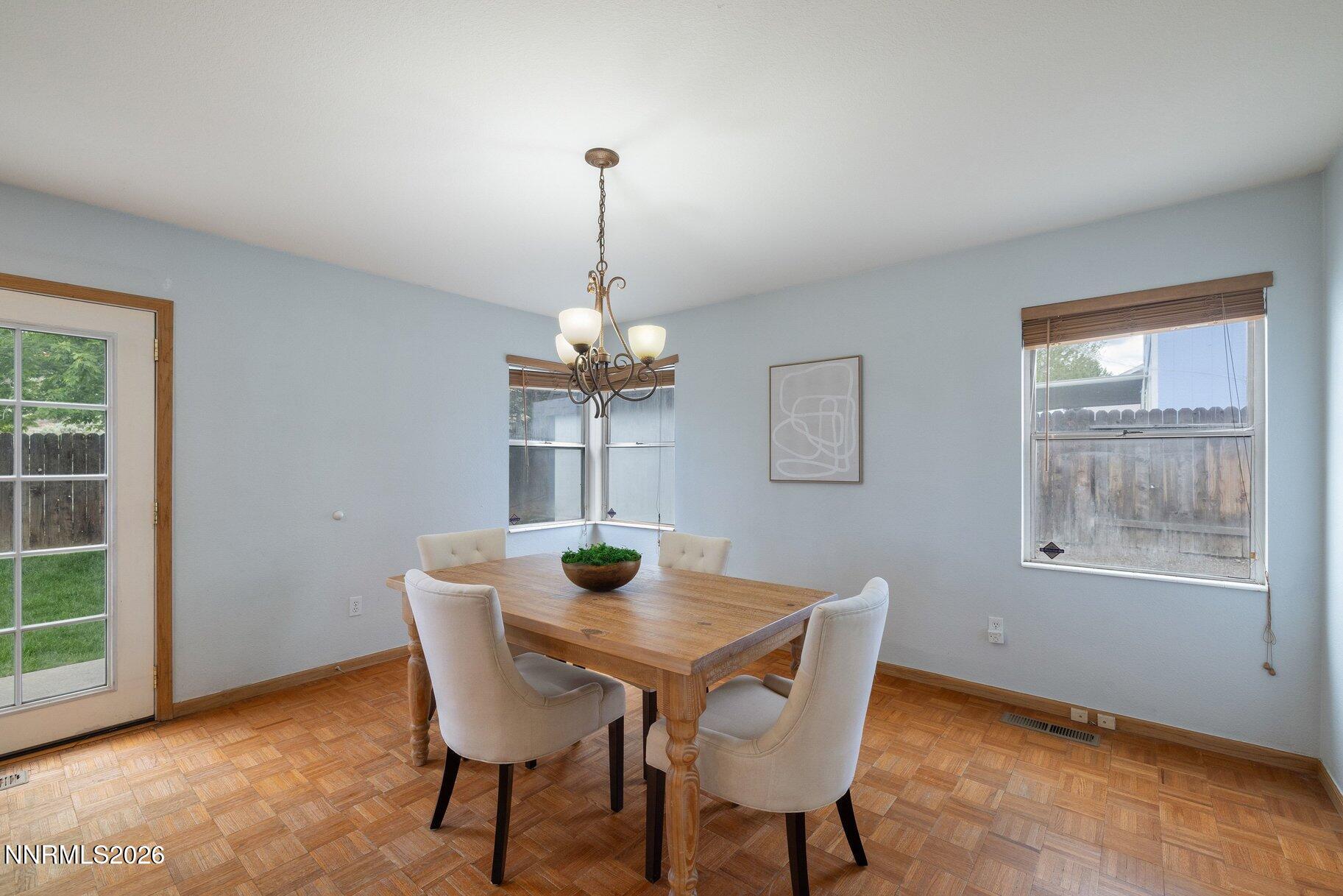 8486 Piper Place Reno, NV 89506 - Photo 14 of 80 a view of a dining room with a table and chairs