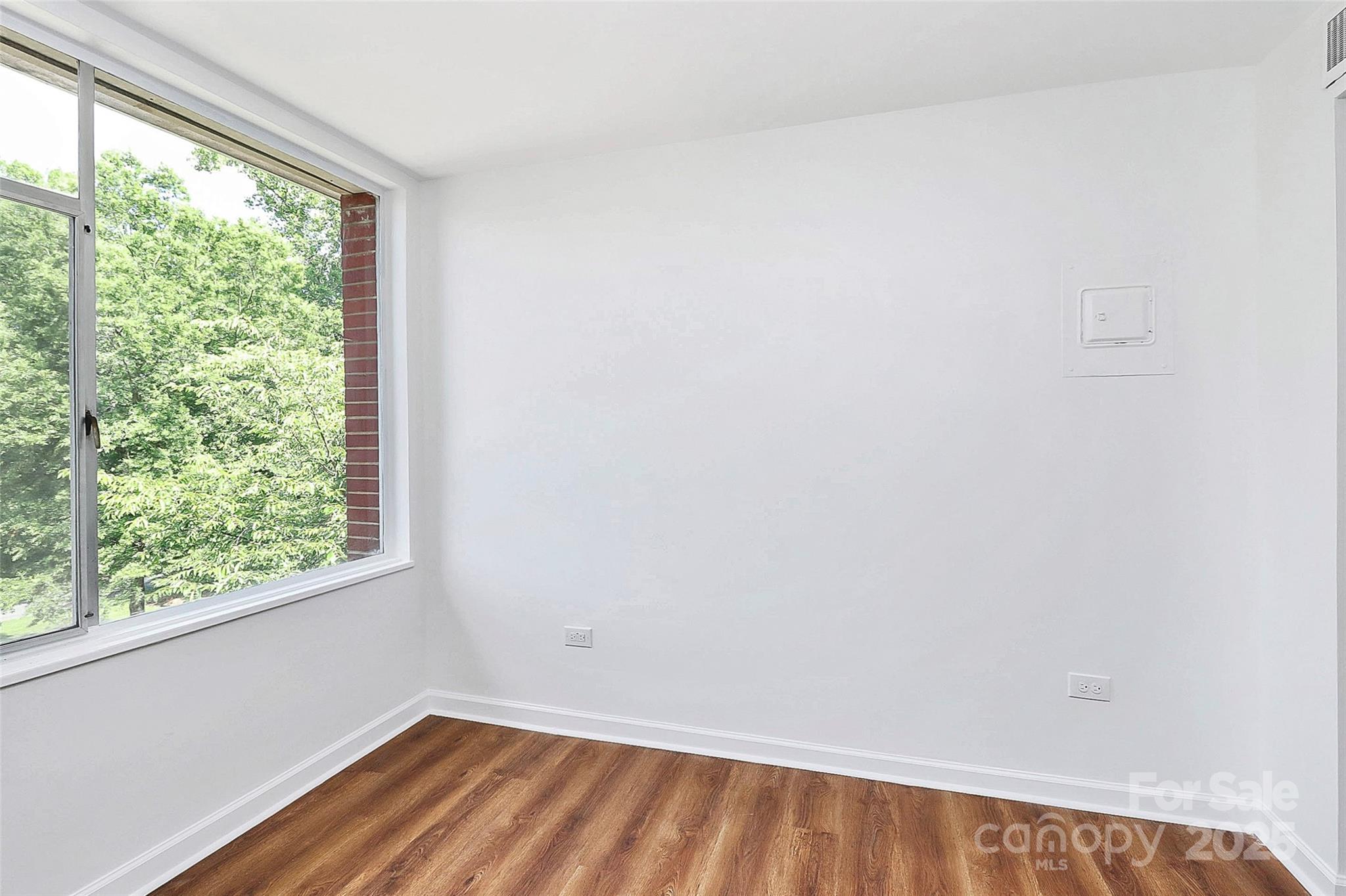 1300 Queens Road, Unit 405 Charlotte, NC 28207 - Photo 14 of 36 an empty room with a window