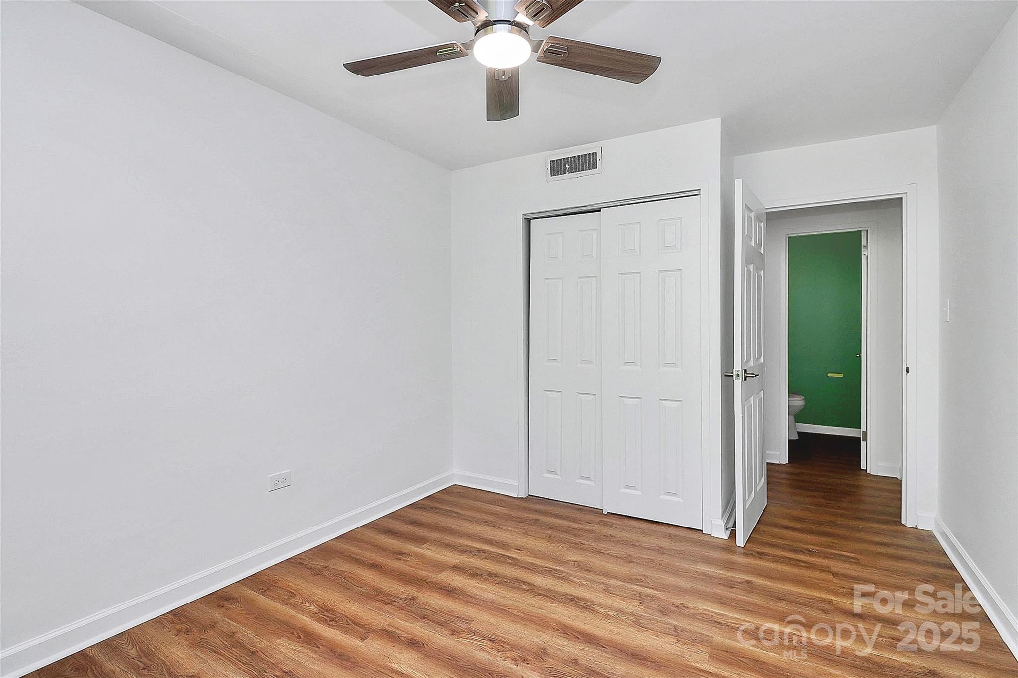 1300 Queens Road, Unit 405 Charlotte, NC 28207 - Photo 16 of 36 wooden floor in an empty room with a window