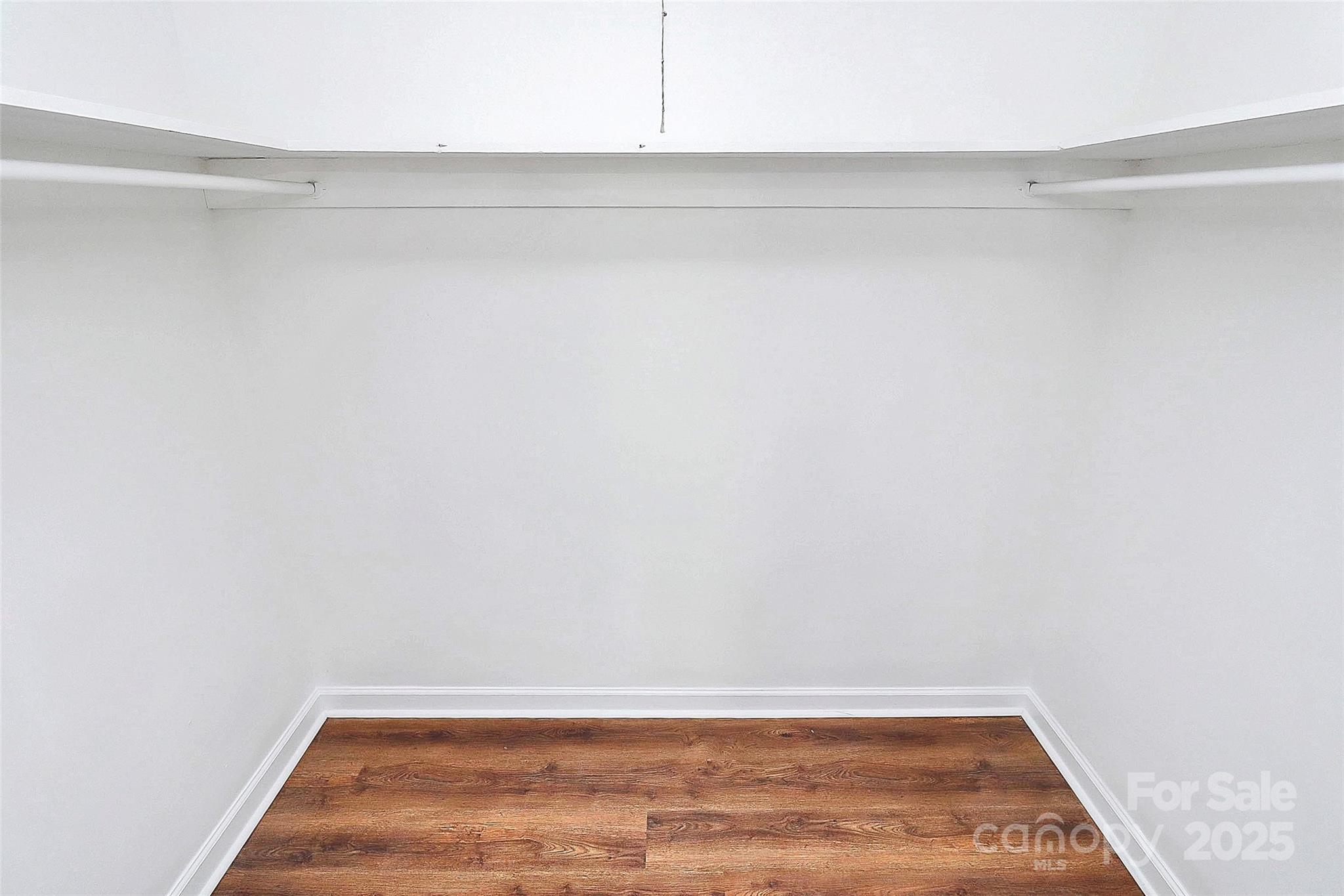 1300 Queens Road, Unit 405 Charlotte, NC 28207 - Photo 21 of 36 a view of a room with wooden floor