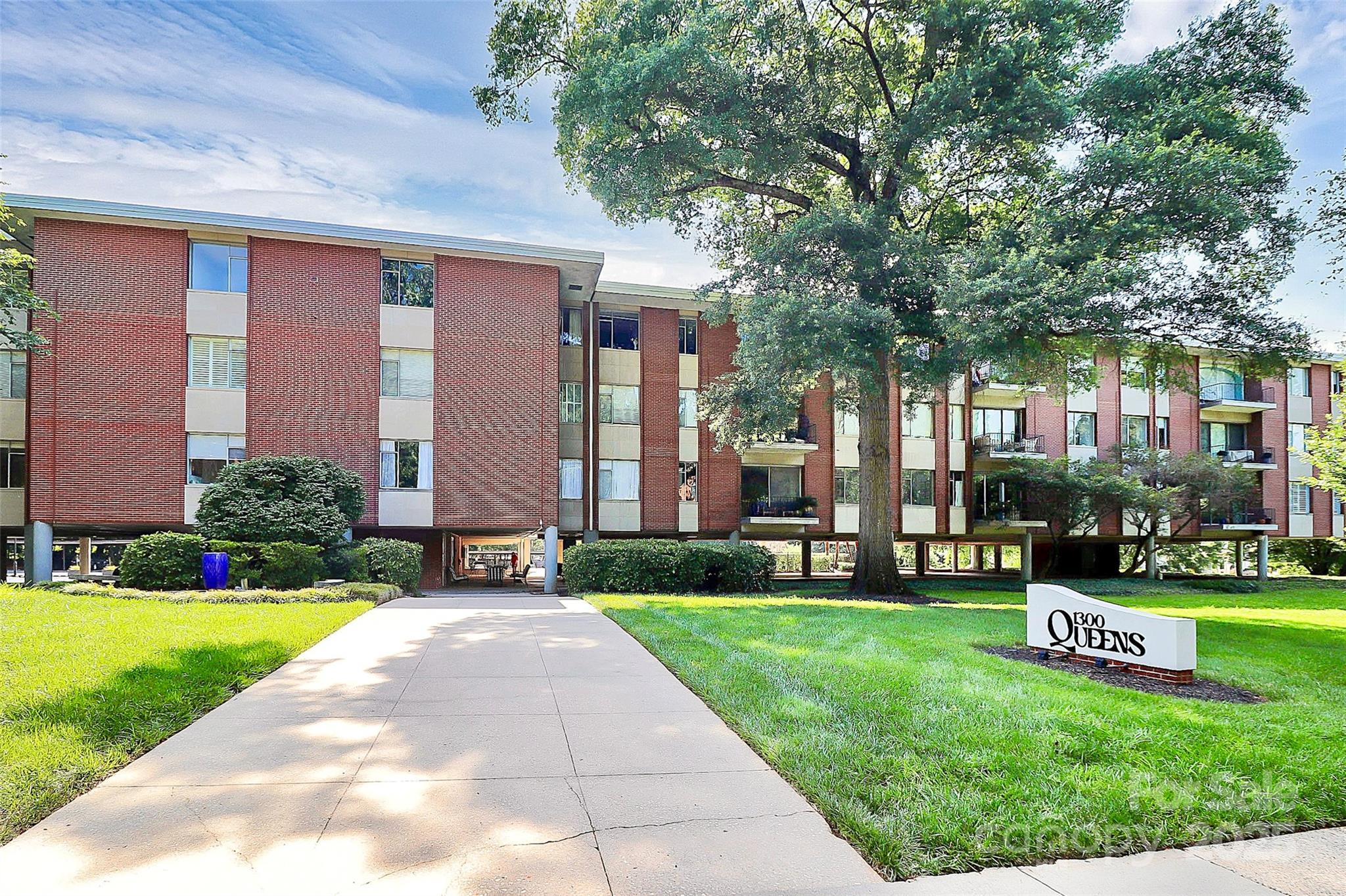 1300 Queens Road, Unit 405 Charlotte, NC 28207 - Photo 31 of 36 a front view of a house with a yard
