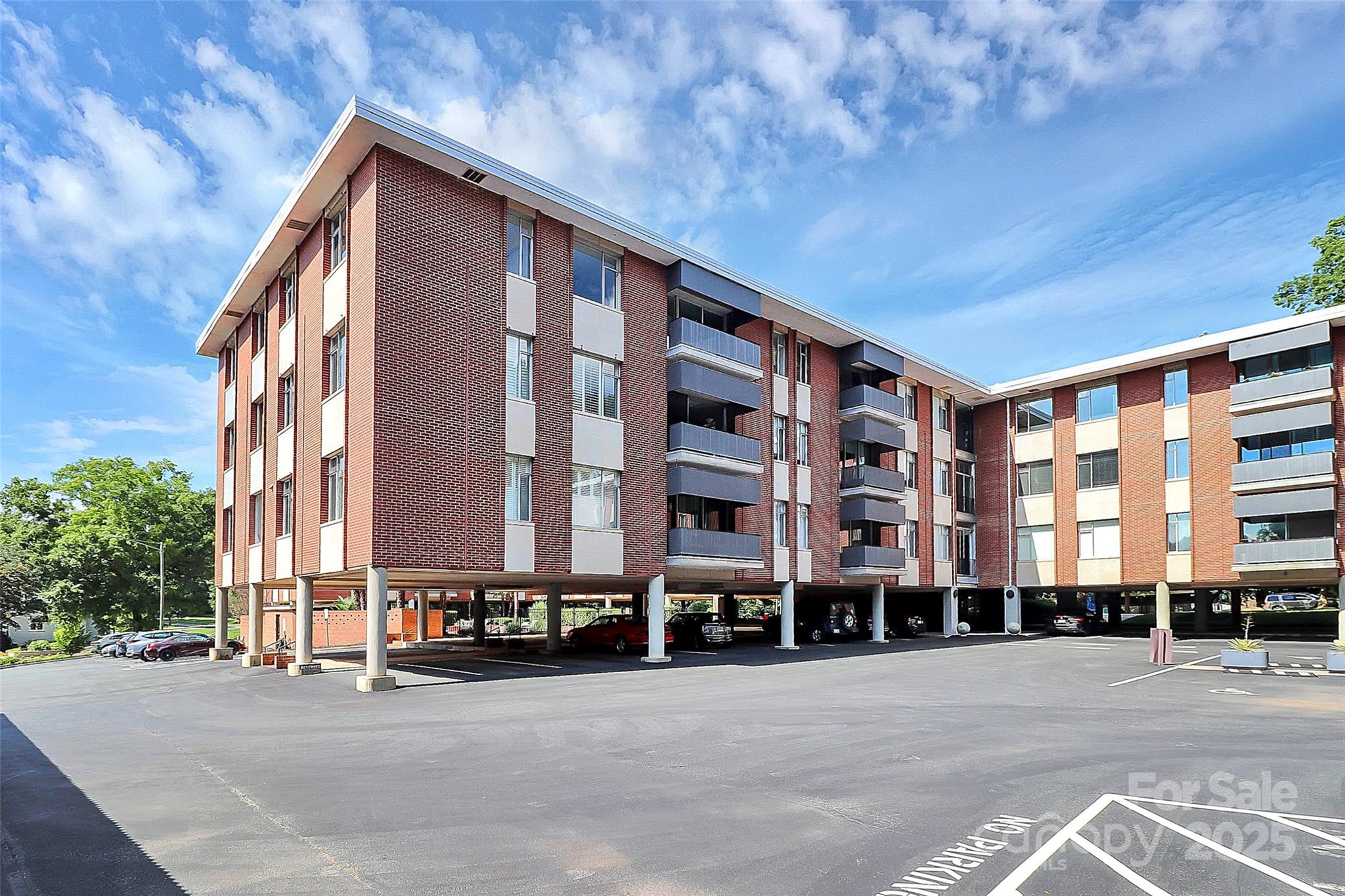 1300 Queens Road, Unit 405 Charlotte, NC 28207 - Photo 32 of 36 a front view of a building with a street
