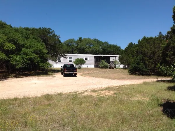 a view of back yard of the house