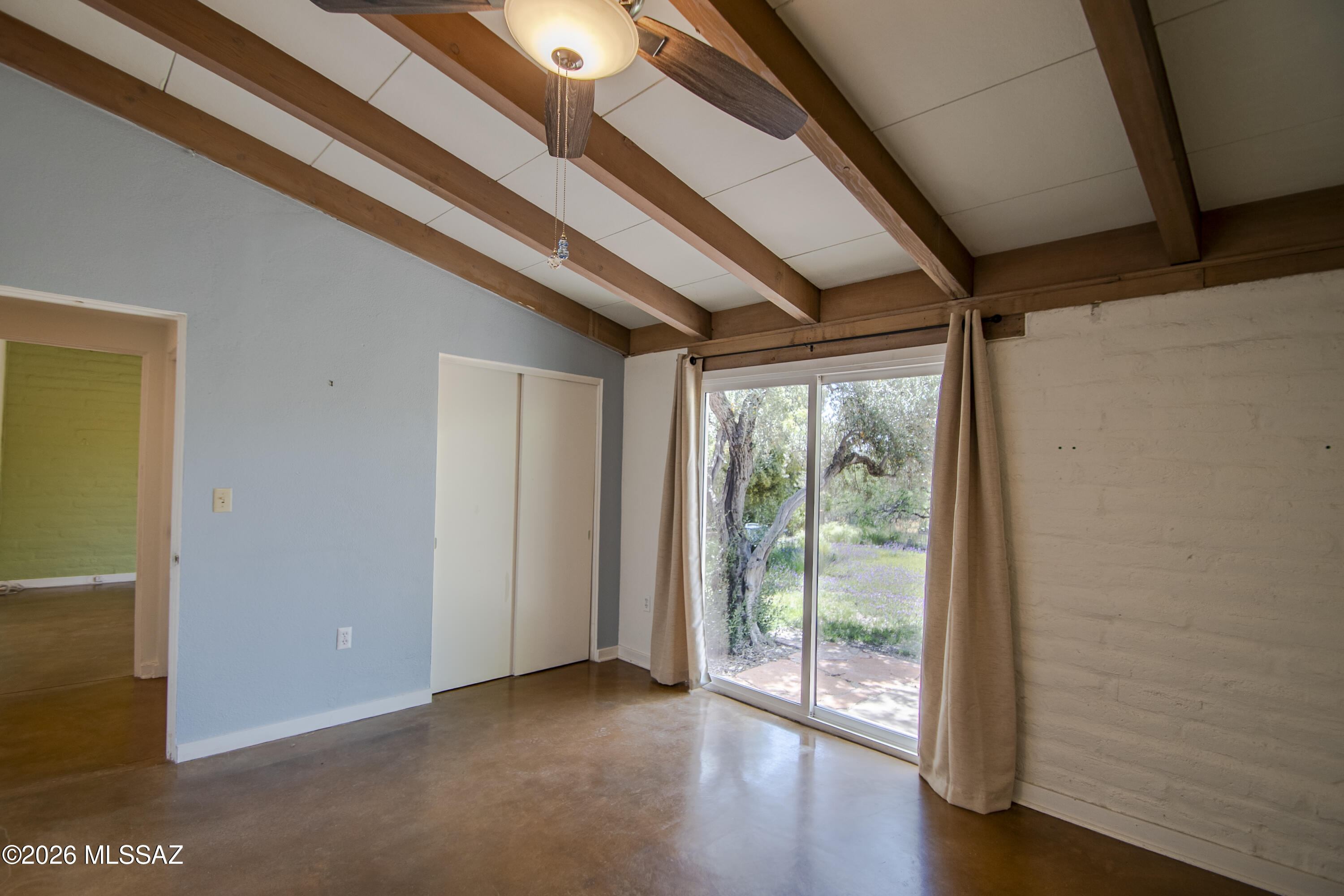 4130 East River Road Tucson, AZ 85718 - Photo 20 of 46 a view of a room with wooden floor and doors