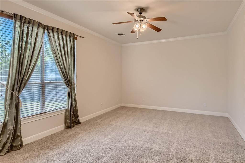 3822 Remington Road Cedar Park, TX 78613 - Photo 16 of 31 an empty room with windows and fan