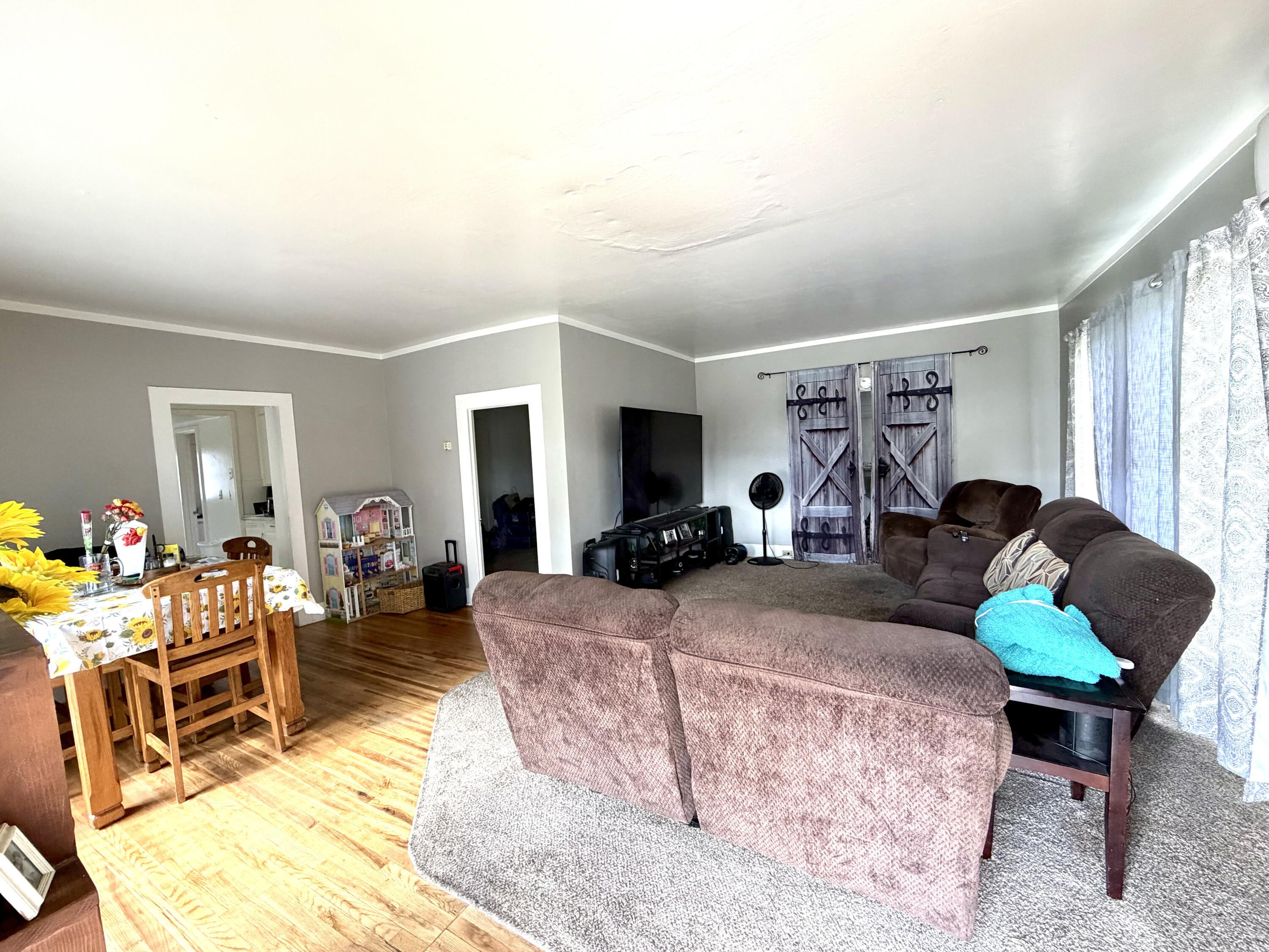 200 North B Street Exeter, CA 93221 - Photo 4 of 20 a living room with furniture and a wooden floor