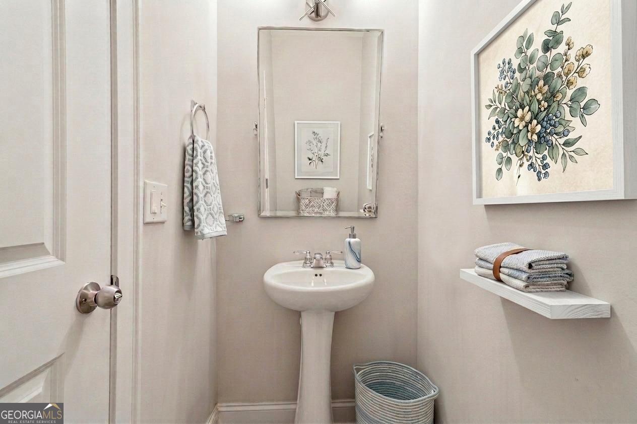 17 Lake Sydney Drive Dawsonville, GA 30534 - Photo 11 of 52 a bathroom with a sink and a mirror