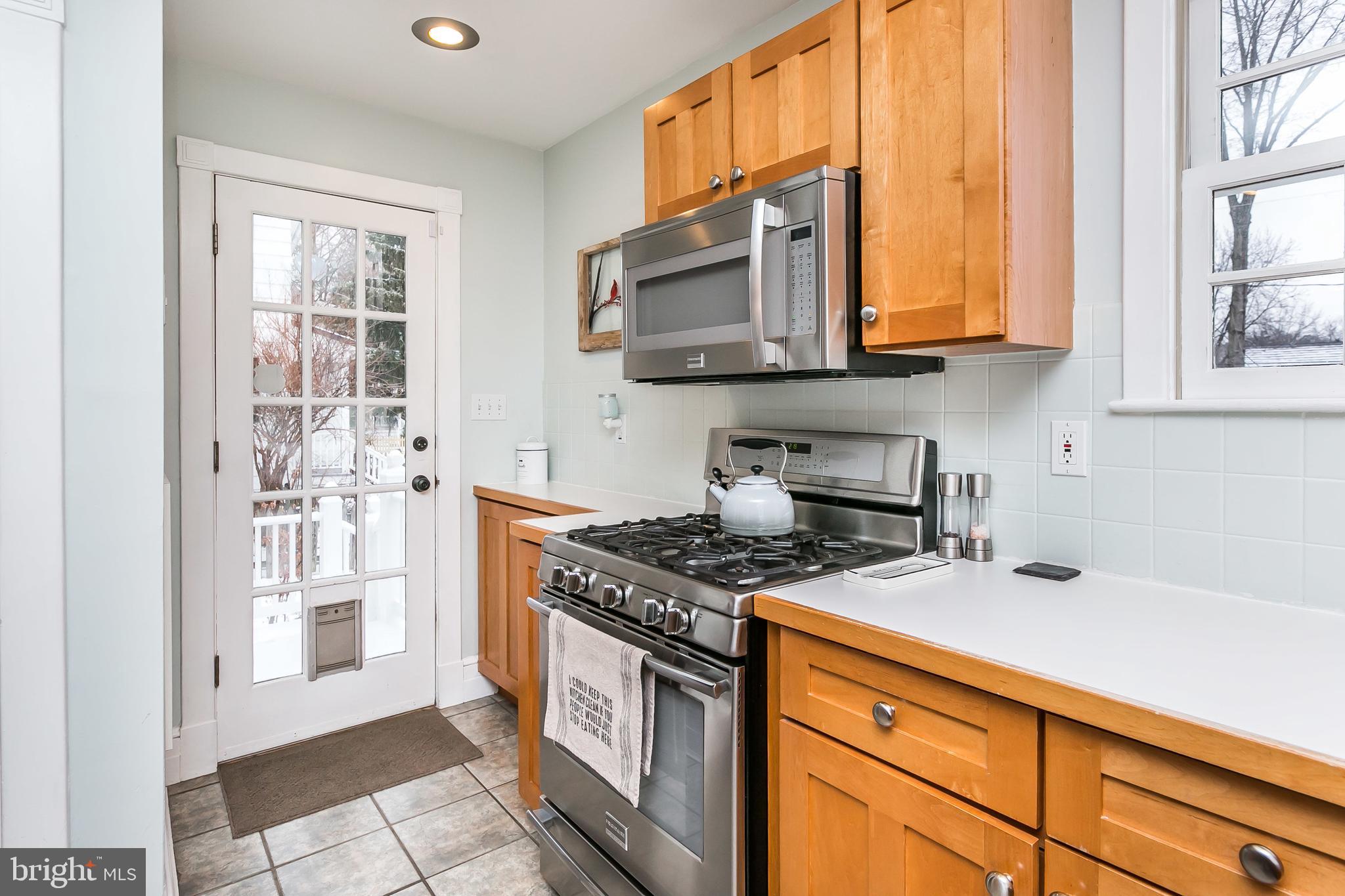 317 Tunbridge Road Baltimore, MD 21212 - Photo 18 of 42 The kitchen has a glass door to the rear deck.