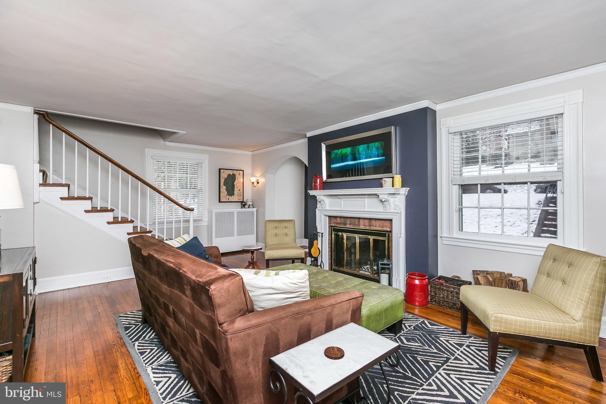 317 Tunbridge Road Baltimore, MD 21212 - Photo 7 of 42 Living room has a lovely fireplace