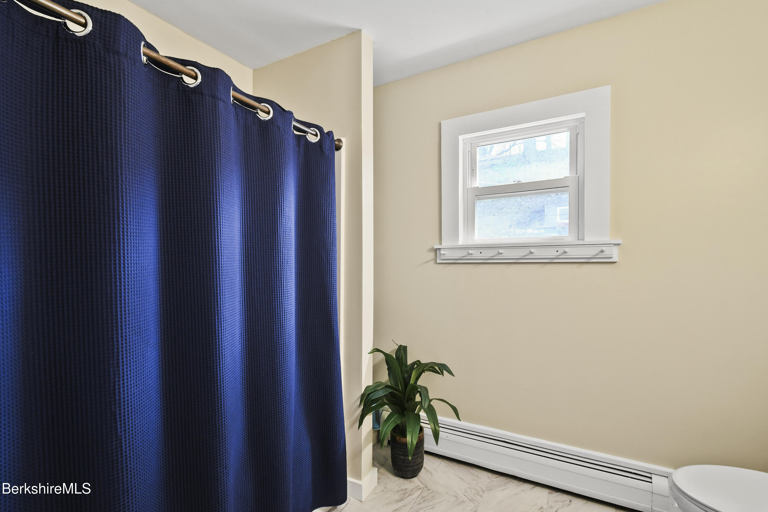 28 Upton Street Adams, MA 01220 - Photo 12 of 29 a view of closet with window and flower