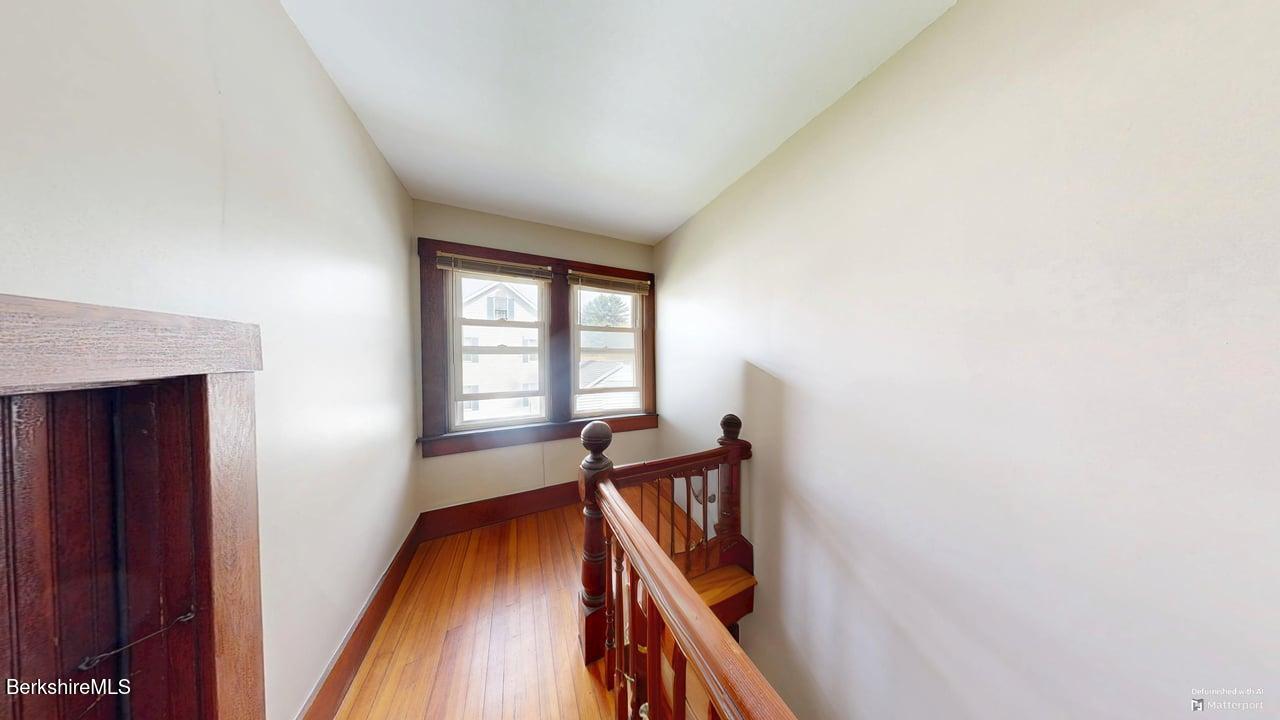 28 Upton Street Adams, MA 01220 - Photo 15 of 29 a view of an empty room with wooden floor and a window