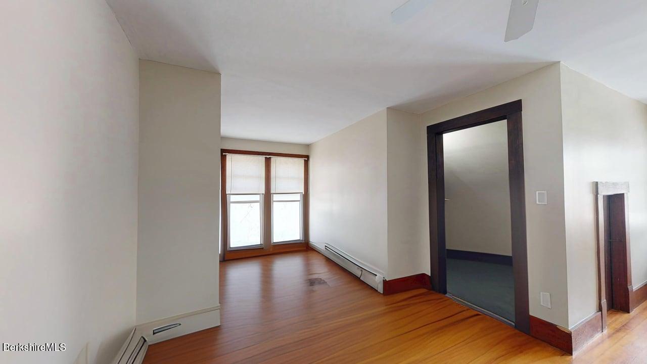 28 Upton Street Adams, MA 01220 - Photo 16 of 29 a view of an empty room with window and wooden floor