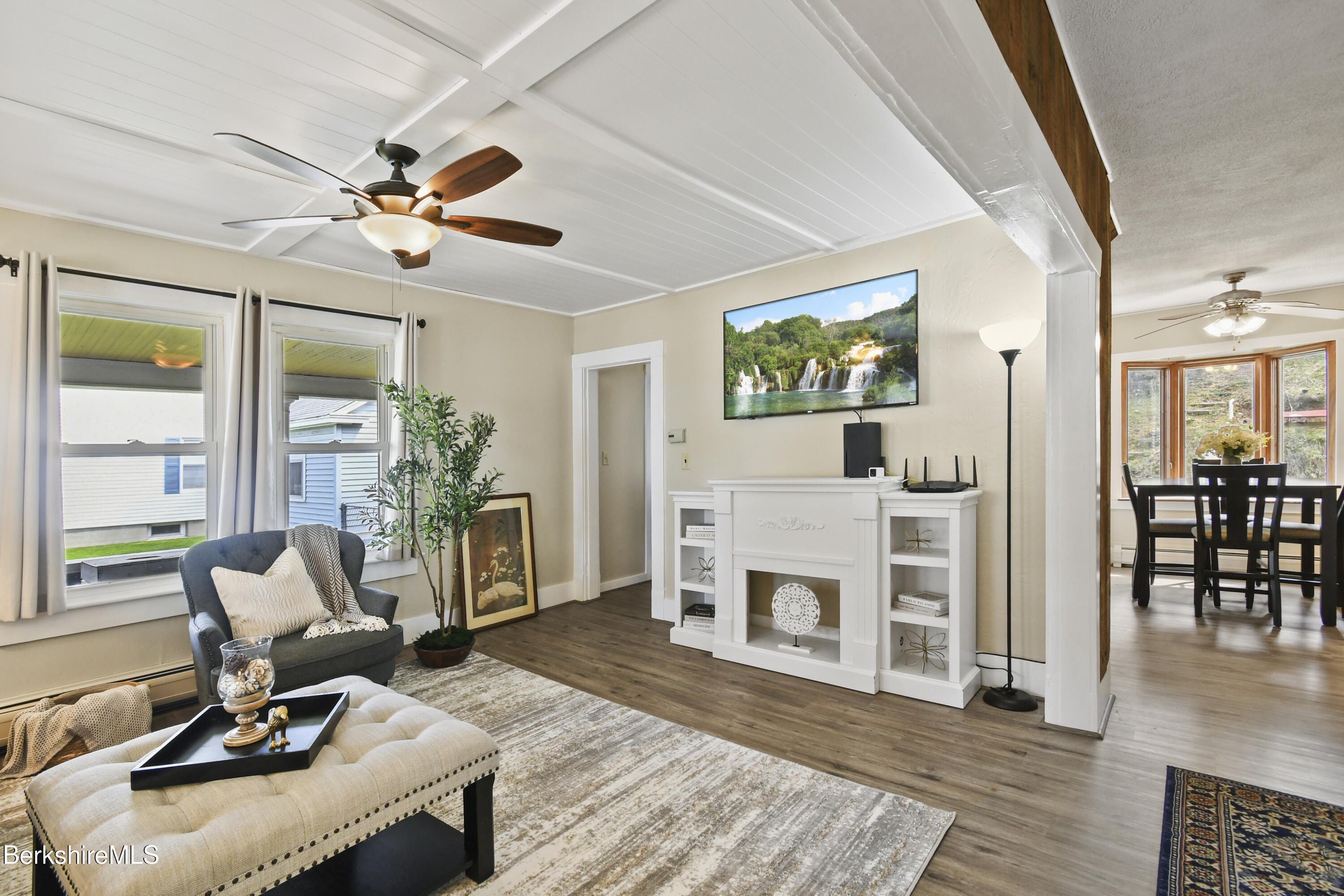 28 Upton Street Adams, MA 01220 - Photo 3 of 29 a living room with furniture a fireplace and a flat screen tv