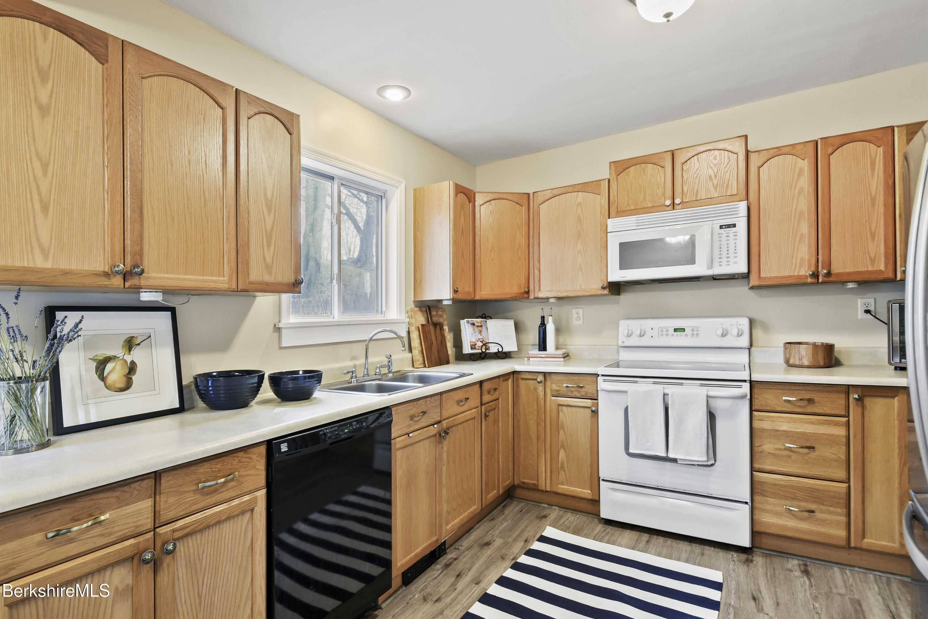 28 Upton Street Adams, MA 01220 - Photo 7 of 29 a kitchen with a sink cabinets and window
