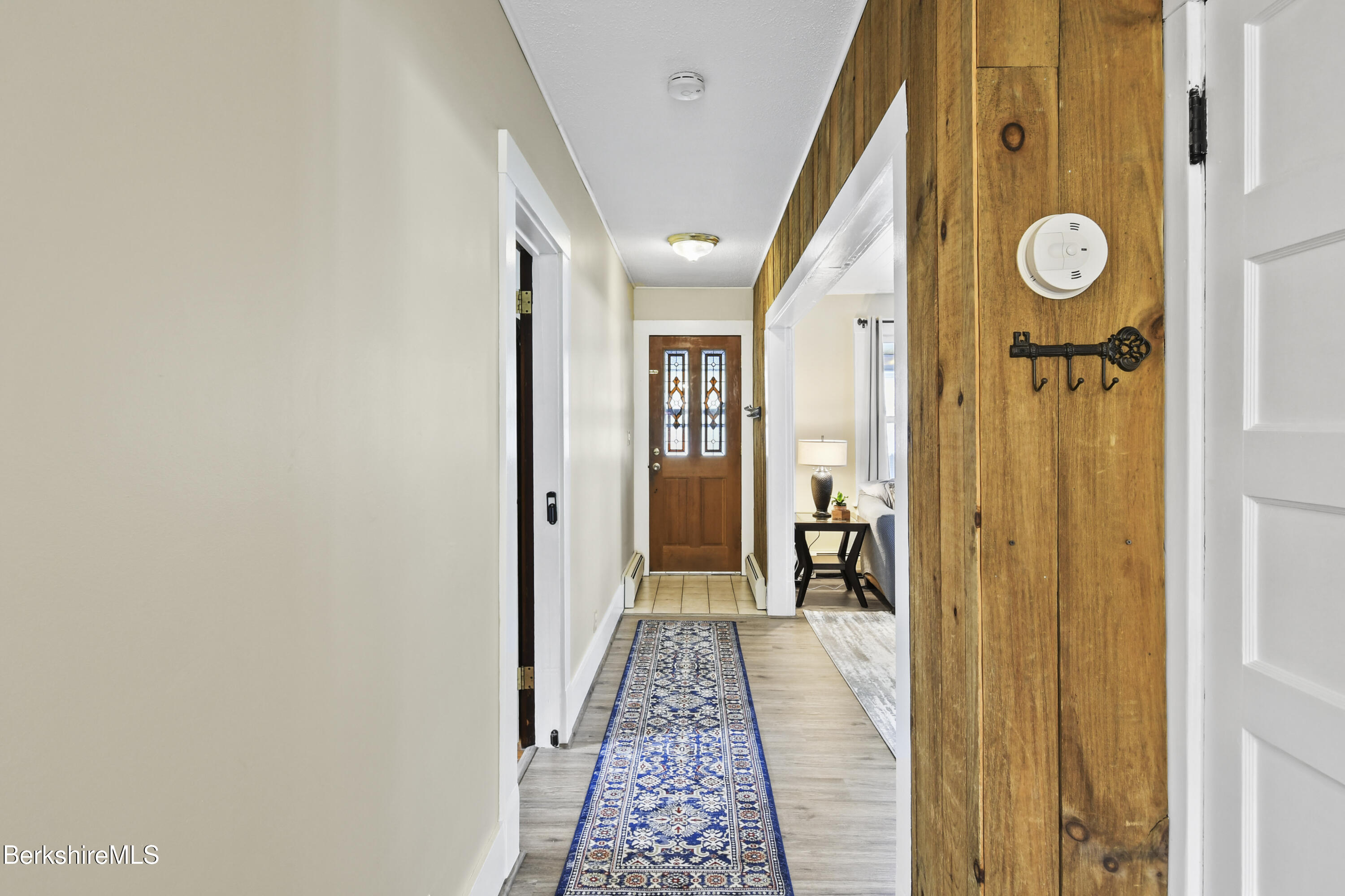 28 Upton Street Adams, MA 01220 - Photo 10 of 29 a view of a hallway with wooden floor and entryway