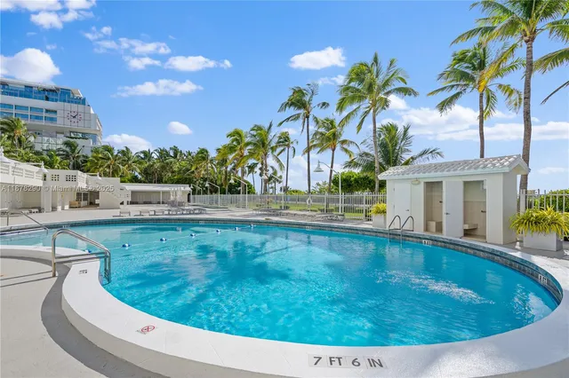 a view of swimming pool with outdoor seating