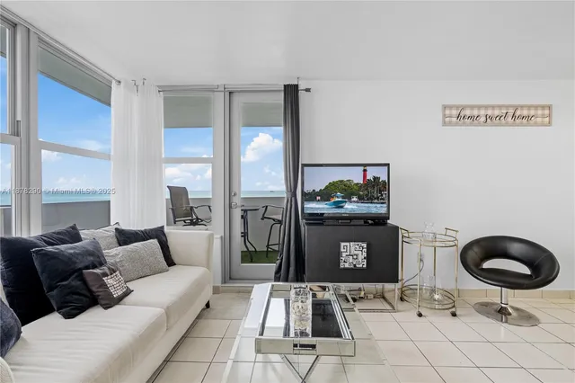 a living room with furniture and a rug