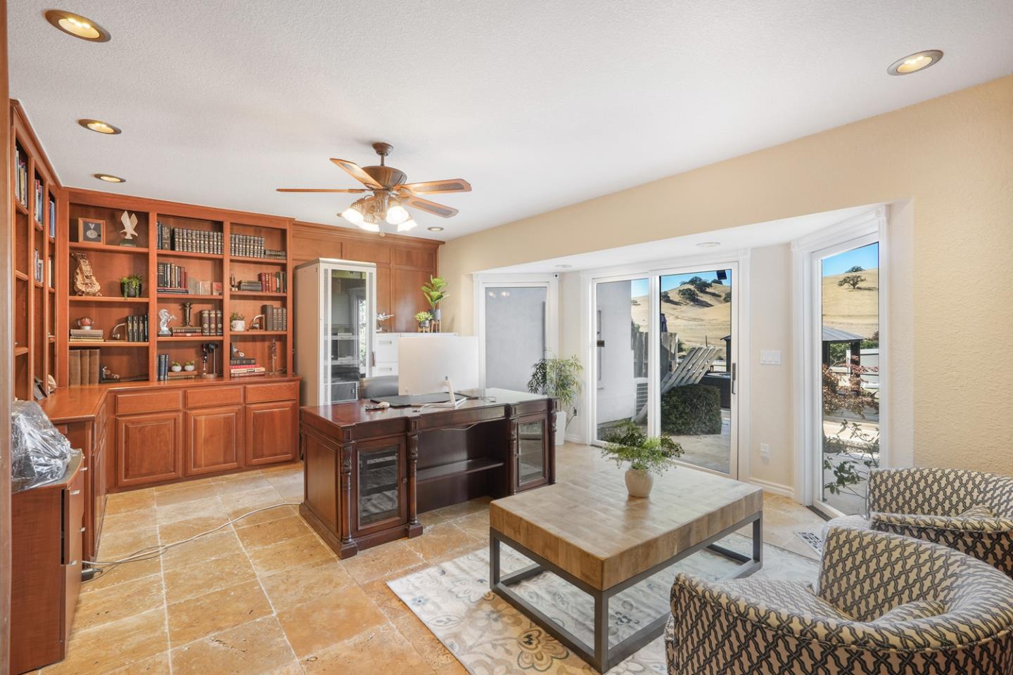 1245 Day Road Gilroy, CA 95020 - Photo 22 of 55 a living room with furniture a table and a chandelier