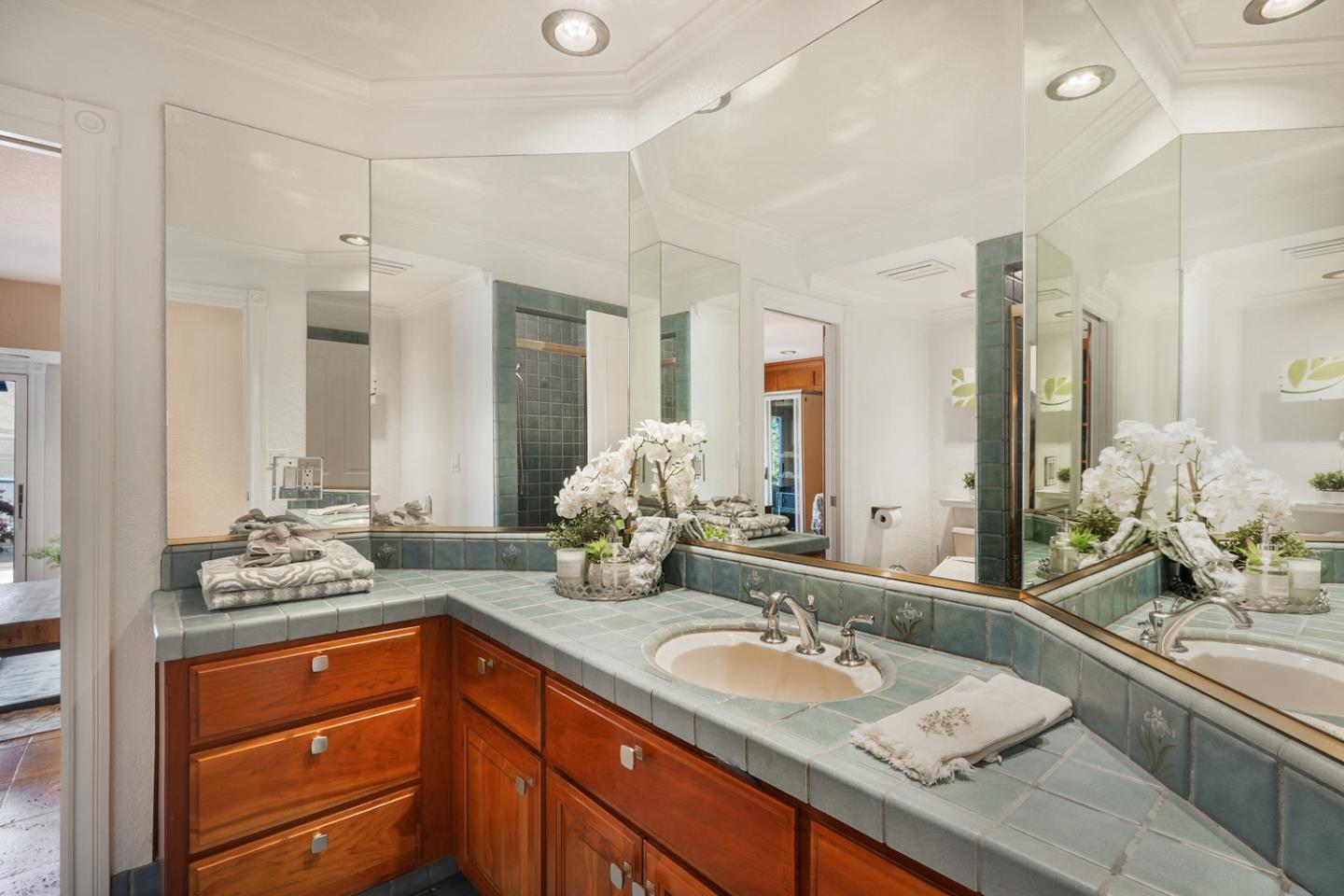 1245 Day Road Gilroy, CA 95020 - Photo 24 of 55 a bathroom with a granite countertop sink and a mirror