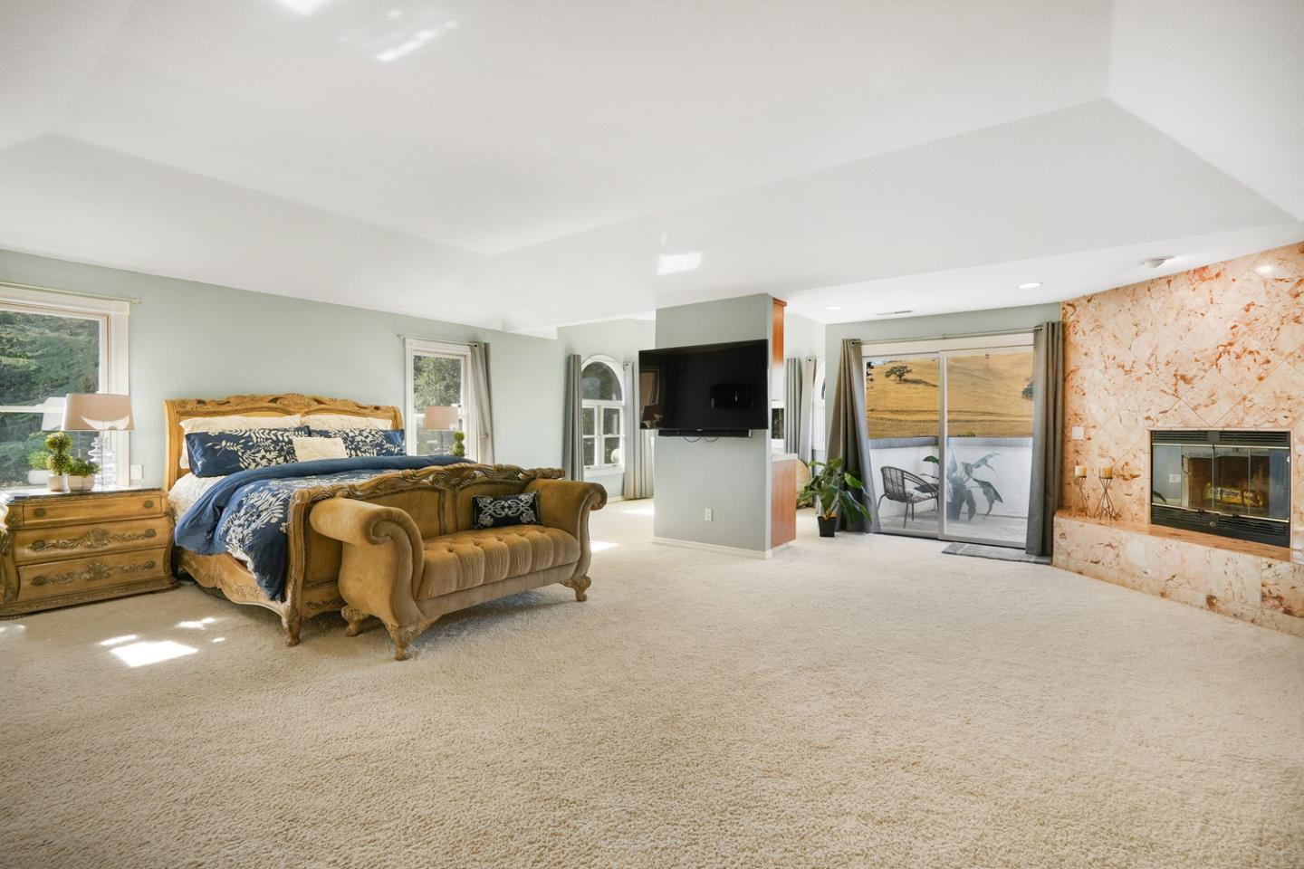 1245 Day Road Gilroy, CA 95020 - Photo 29 of 55 a bedroom with a bed and a flat screen tv