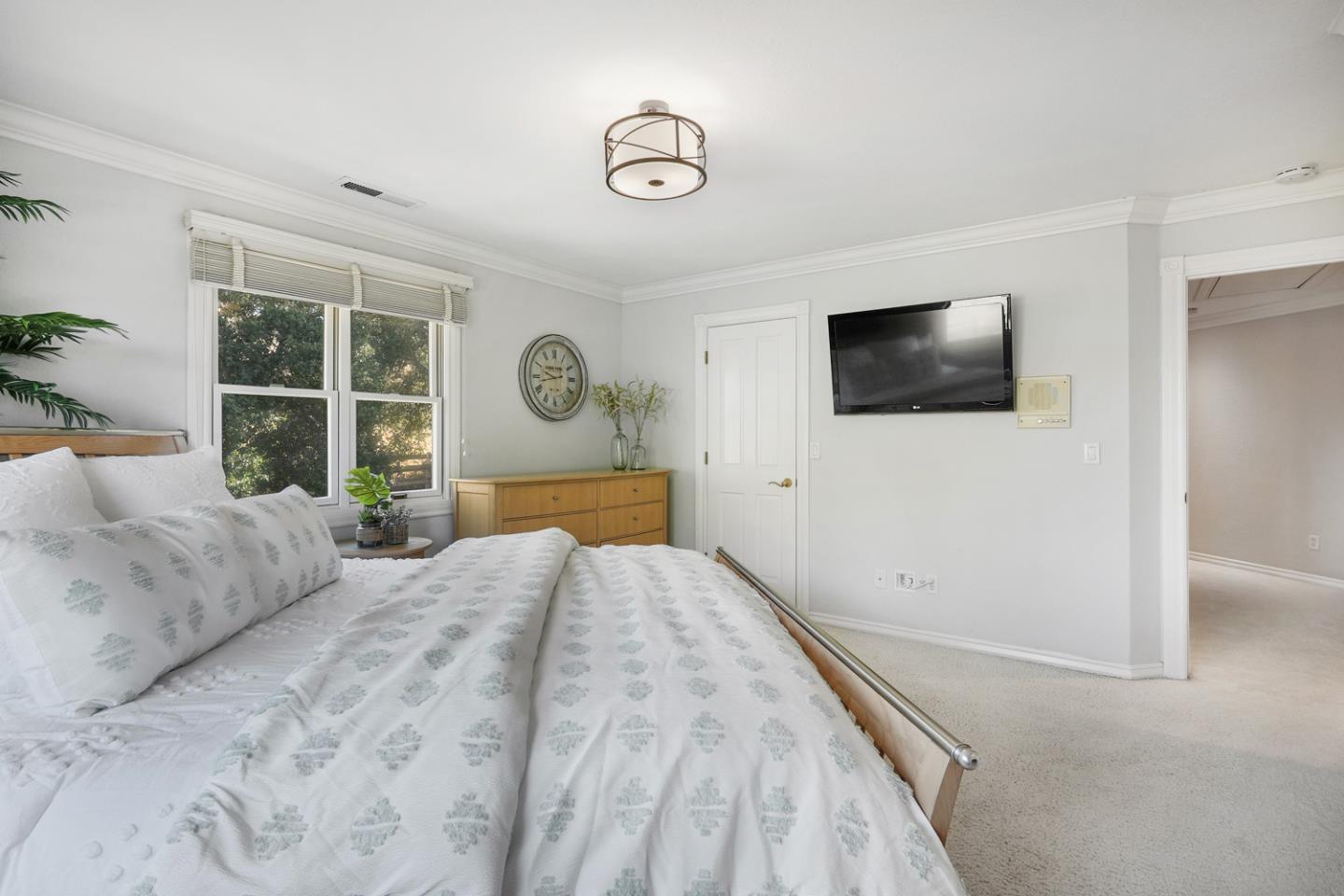 1245 Day Road Gilroy, CA 95020 - Photo 39 of 55 a bedroom with a bed and a flat screen tv