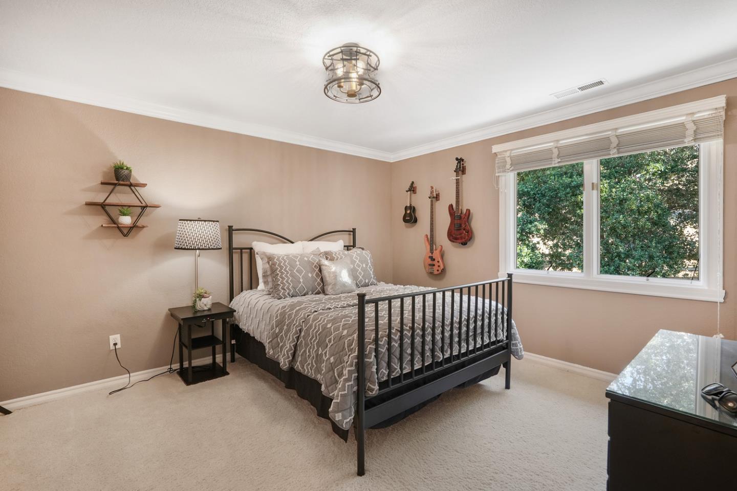 1245 Day Road Gilroy, CA 95020 - Photo 41 of 55 a bed sitting in a bedroom next to a window