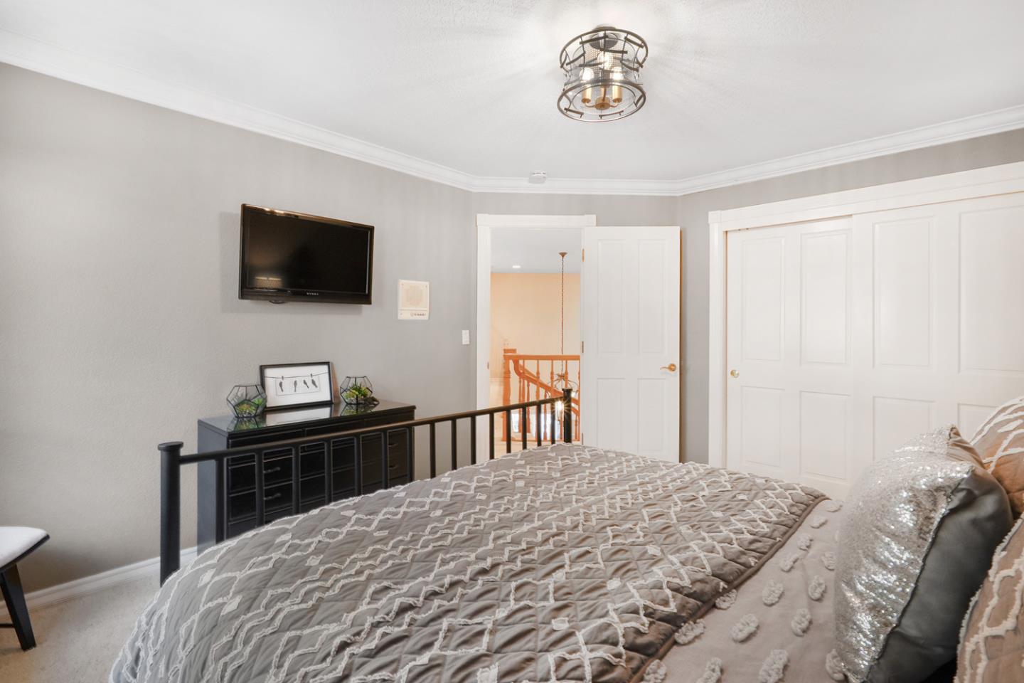 1245 Day Road Gilroy, CA 95020 - Photo 42 of 55 a bedroom with a bed and a flat screen tv